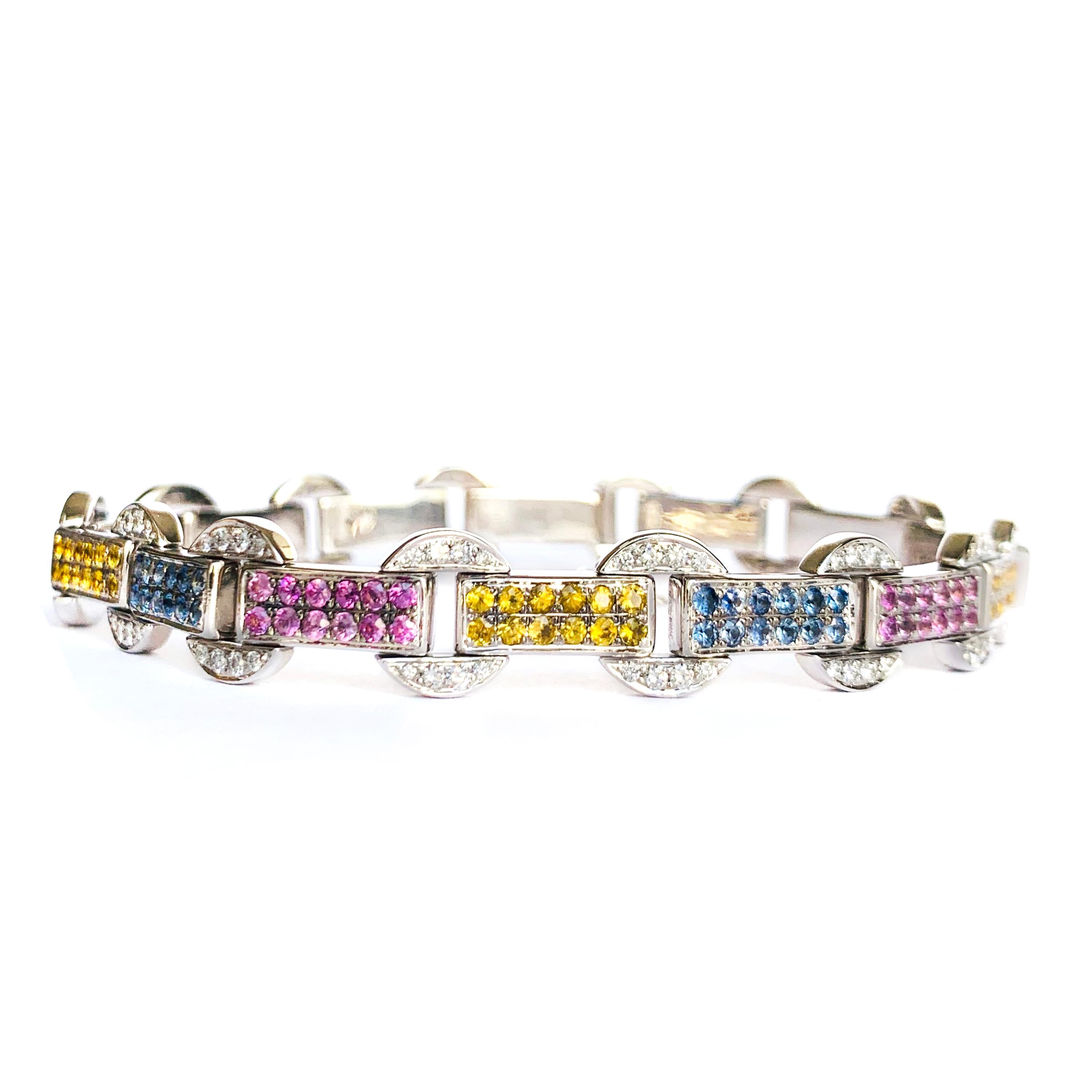 Rosior by Manuel Rosas contemporary 19,2k white gold bracelet setted with:
- 112 diamonds with 0,94ct,
- 167 blue, yellow and pink sapphires with 3,34ct.
The bracelet is totally articulated and 