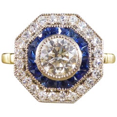 Contemporary Diamond and Sapphire Target Ring Modelled in 18 Carat Gold
