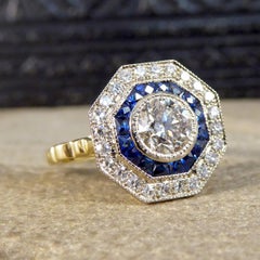 Contemporary Diamond and Sapphire Target Ring Modelled in 18 Carat Gold