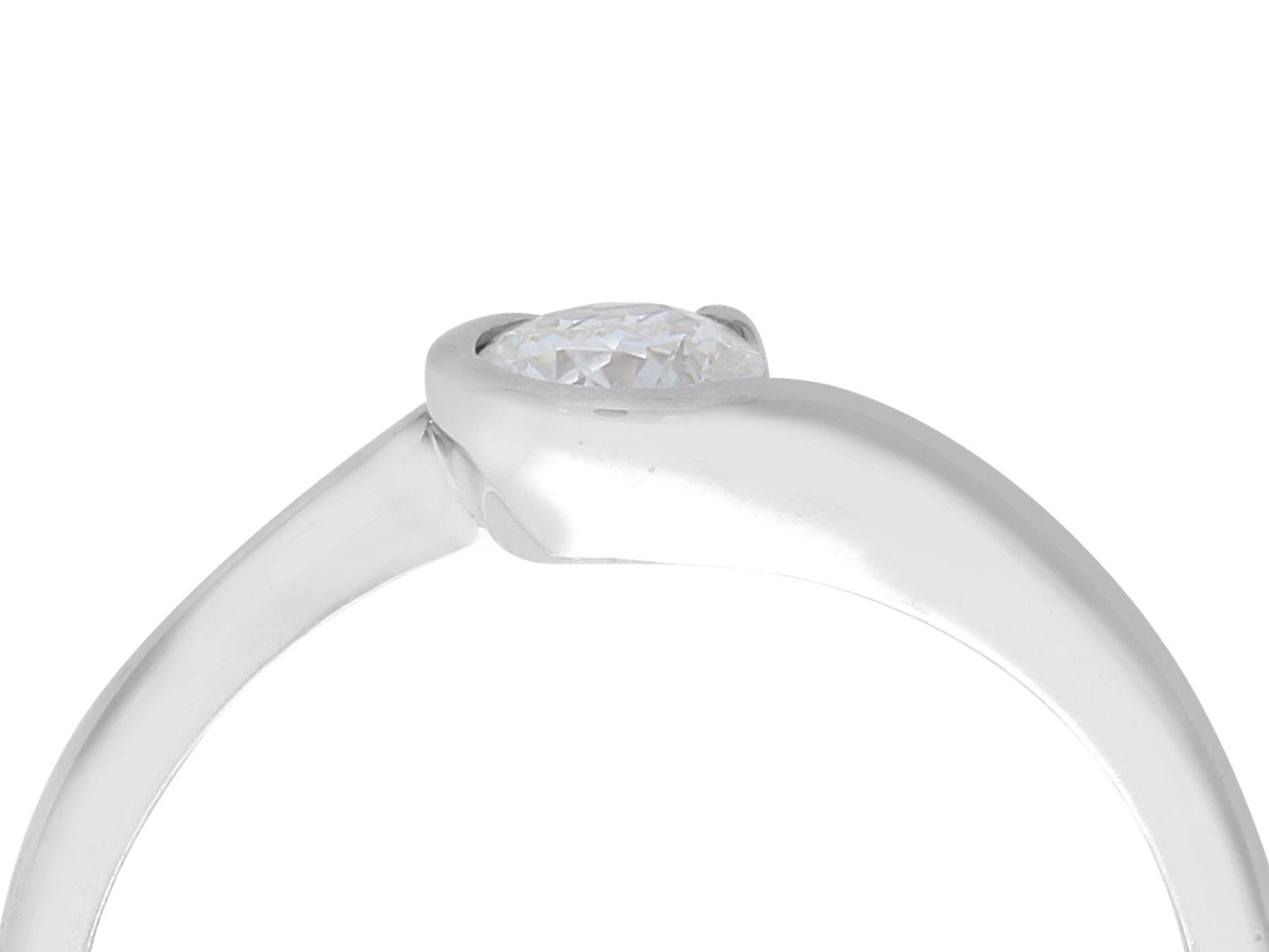 A fine and impressive contemporary 0.37 carat diamond and 18k white gold solitaire ring; part of our diverse diamond jewelry and estate jewelry collections

This fine and impressive diamond solitaire twist ring has been crafted in 18k white