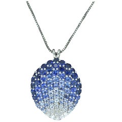 Contemporary Diamond, Blue Sapphire and White Sapphire Pendant