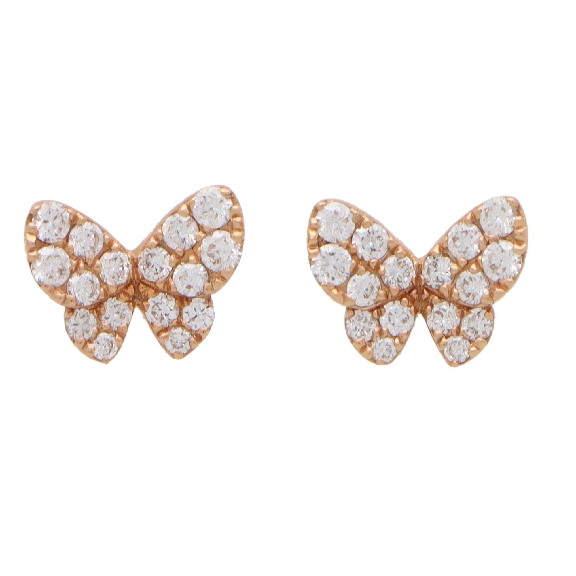 A beautiful pair of modern diamond set butterfly earrings set in 18k rose gold.

Each stud earring is pave set throughout with 16 round brilliant cut diamonds. Due to their design and size these studs would make a perfect pair of everyday earrings.