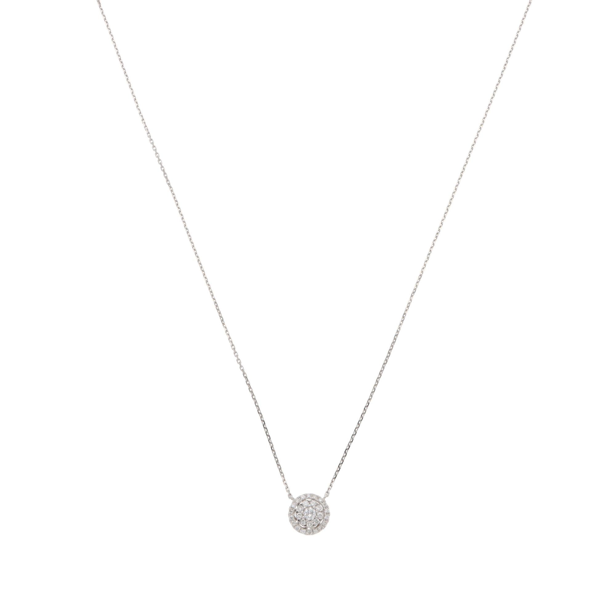 A beautiful contemporary diamond cluster pendant necklace set in 18k white gold.

The pendant is predominately set with a round brilliant-cut diamond, surrounded by 27 smaller round brilliant-cut diamonds. The diamonds are set in micro-claw