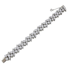 Bracciale Tennis Eternity con diamanti incrociati in stile contemporaneo