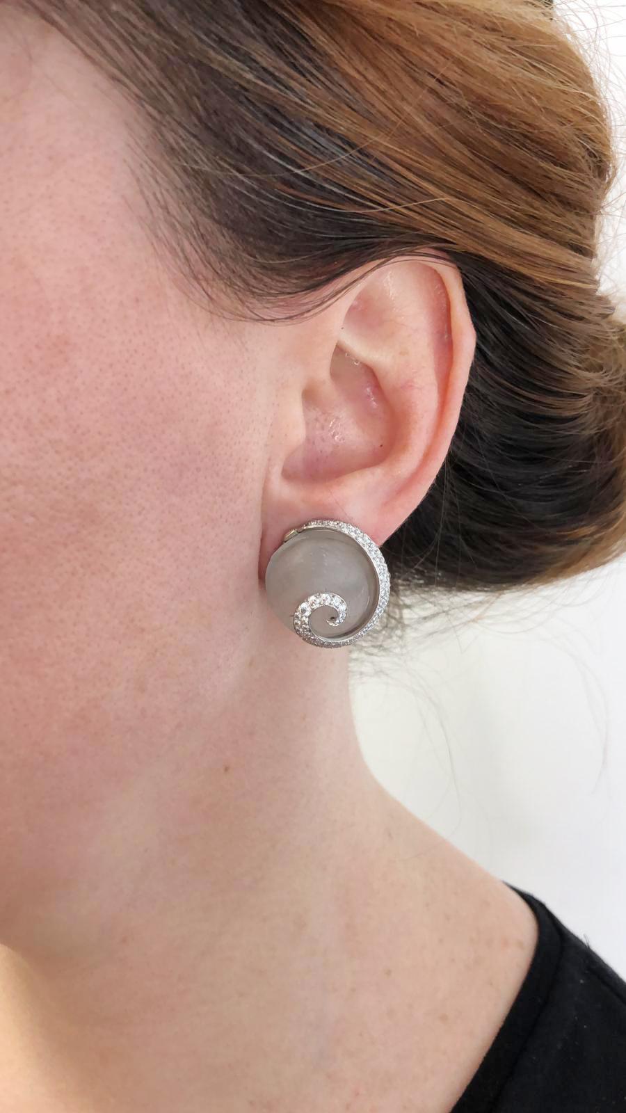 Contemporary Diamond Crystal Seashell Earrings in Platinum and 18k Yellow Gold.
A swirl of white diamond pavé sets a custom-carved gem depicting a pteropod of the sea. The shell form is fashioned from rock crystal, with tiny refinements of texture