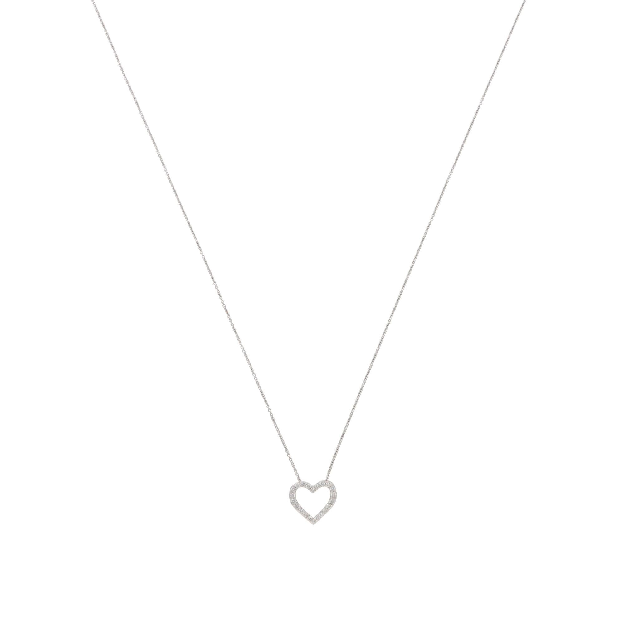 A beautiful contemporary diamond heart pendant necklace set in platinum.

The pendant depicts a heart motif set with 22 round brilliant-cut diamonds. The diamonds are set in micro-claw settings, which beautifully highlights their sparkle and