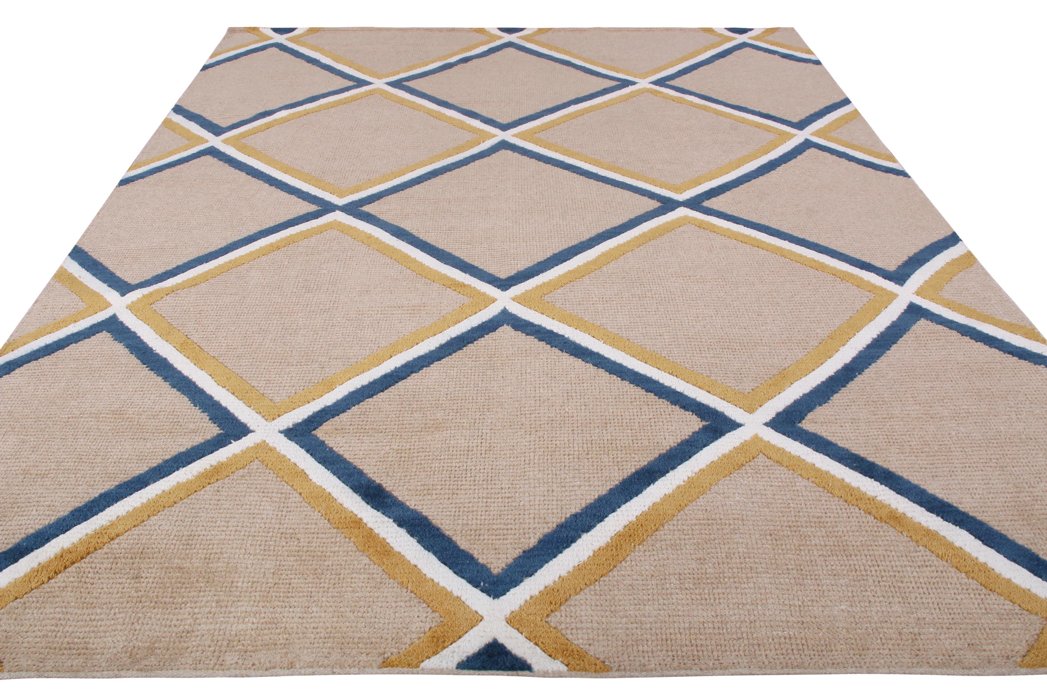 This contemporary diamond pattern rug represents the latest additions to Rug & Kilim’s New and Modern Collections, enjoying an idyllic marriage of reserved, soothing depth and grace in the transitional play of blue and gold over beige; hand knotted