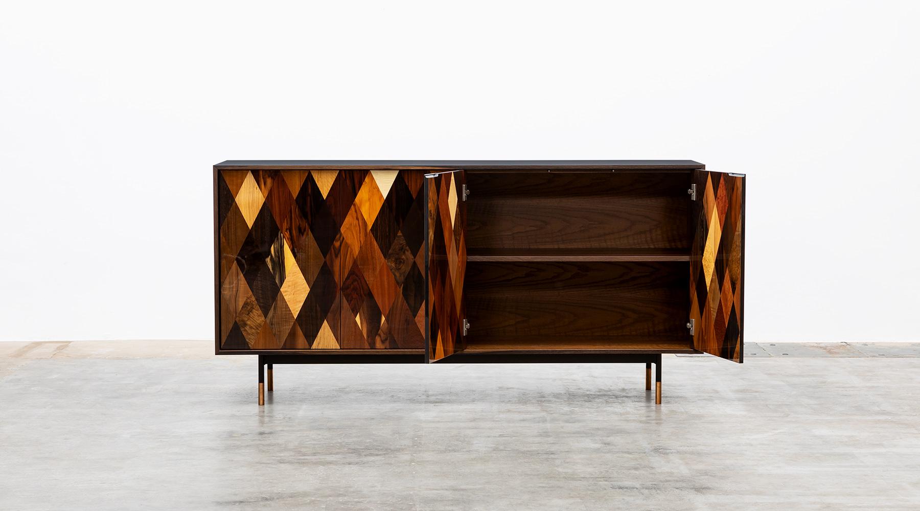 The body of this sideboard is made of ultra-matt HPL in black, the interior and inside of smoked oak, the doors of this unique piece are made of diamond shaped veneers of various origin such as maple, ebony, yew, walnut, rosewood, Makassar, poplar,