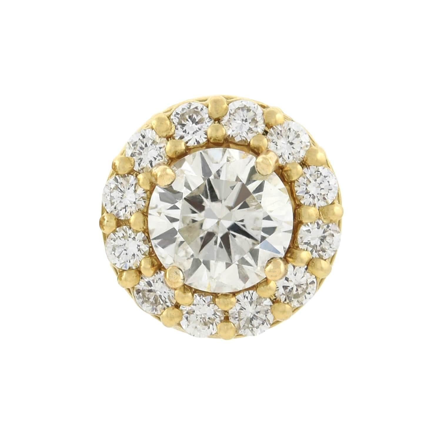 A stunning and versatile pair of Estate diamond earrings! Crafted in 14kt yellow gold, each stud style earring adorns a single Round Brilliant Cut diamond at the center. The prong set stones weigh approximately 0.70ct each, exhibiting H/I color and