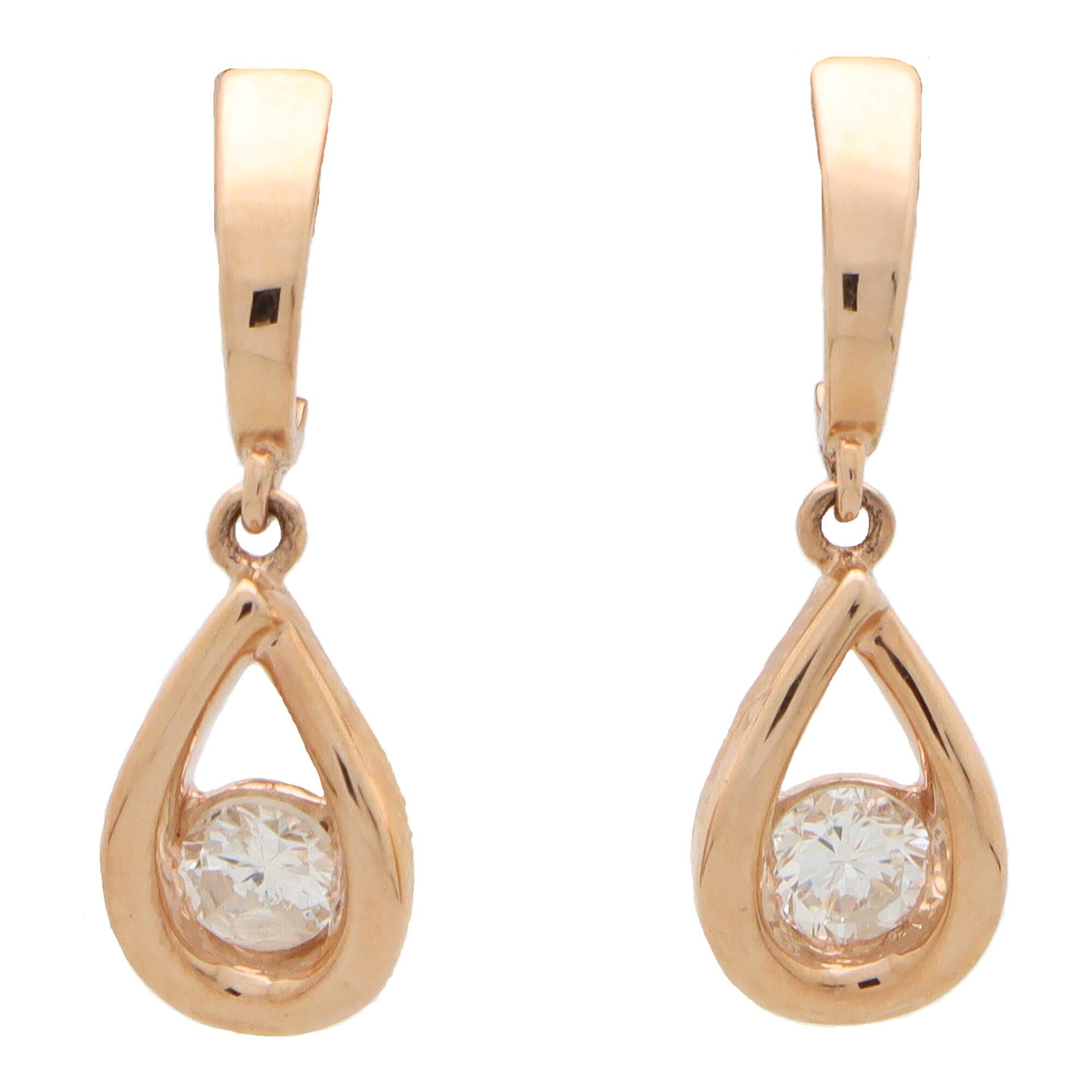 Round Cut Contemporary Diamond Tear Drop Earrings Set in 14k Rose Gold For Sale