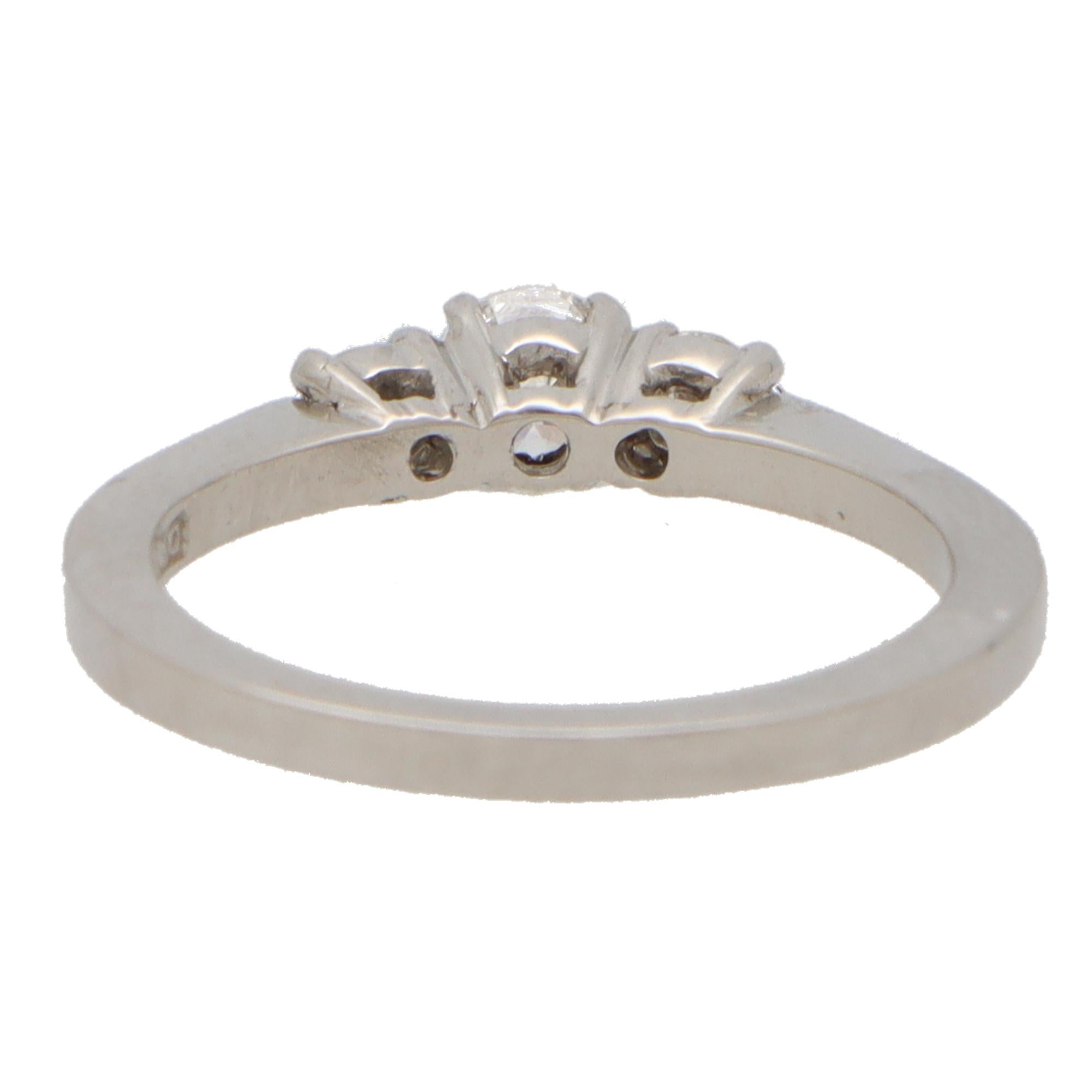Modern Contemporary Diamond Three Stone Ring With Diamond Shoulders in Platinum