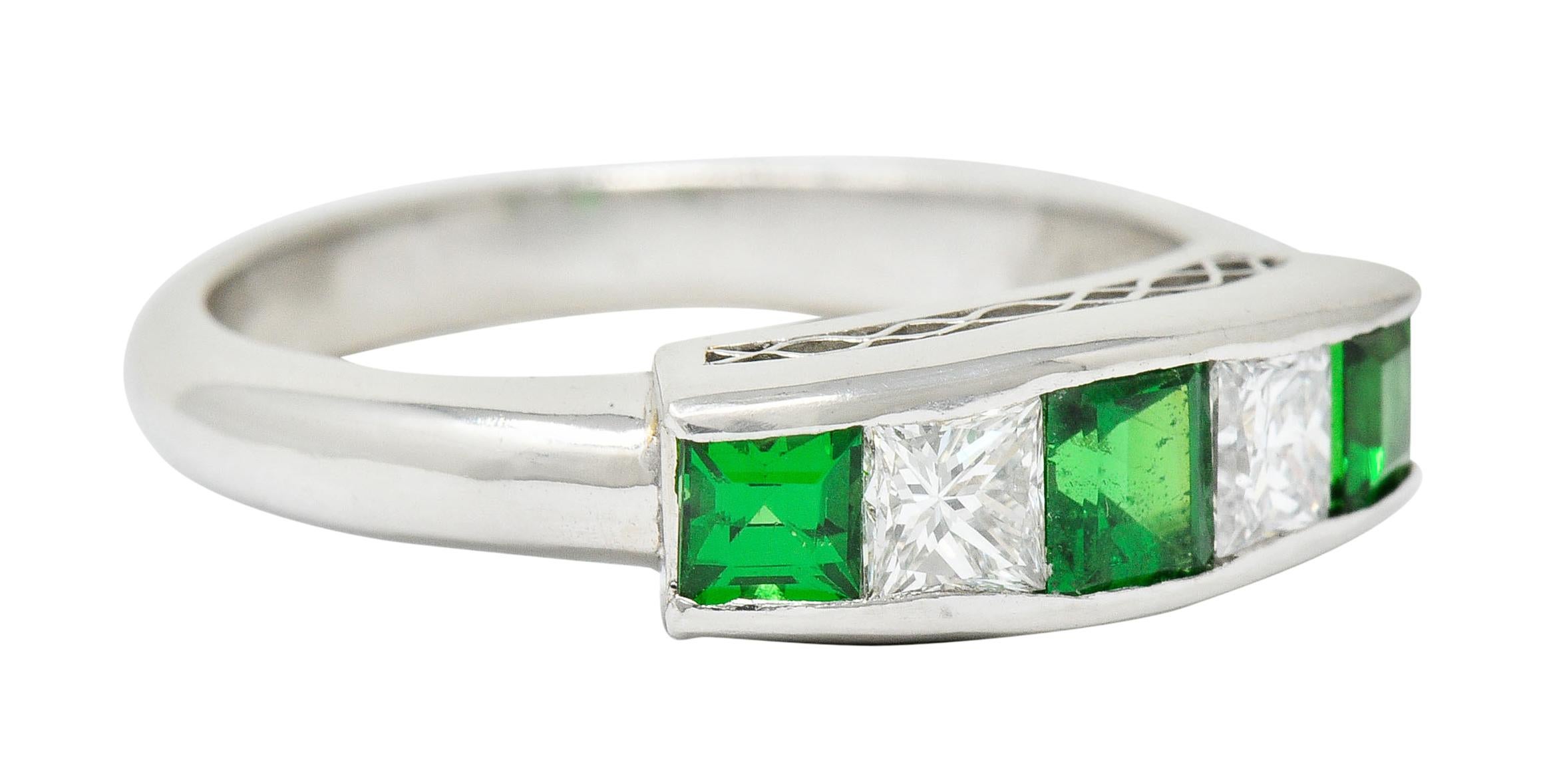 Band style ring channel set to front with tsavorite garnet and diamonds, alternating

Total diamond weight is 0.40 carat with F/G color and VS clarity

Bright green tsavorite garnet weigh in total 0.67 carat

Completed by a pierced lattice