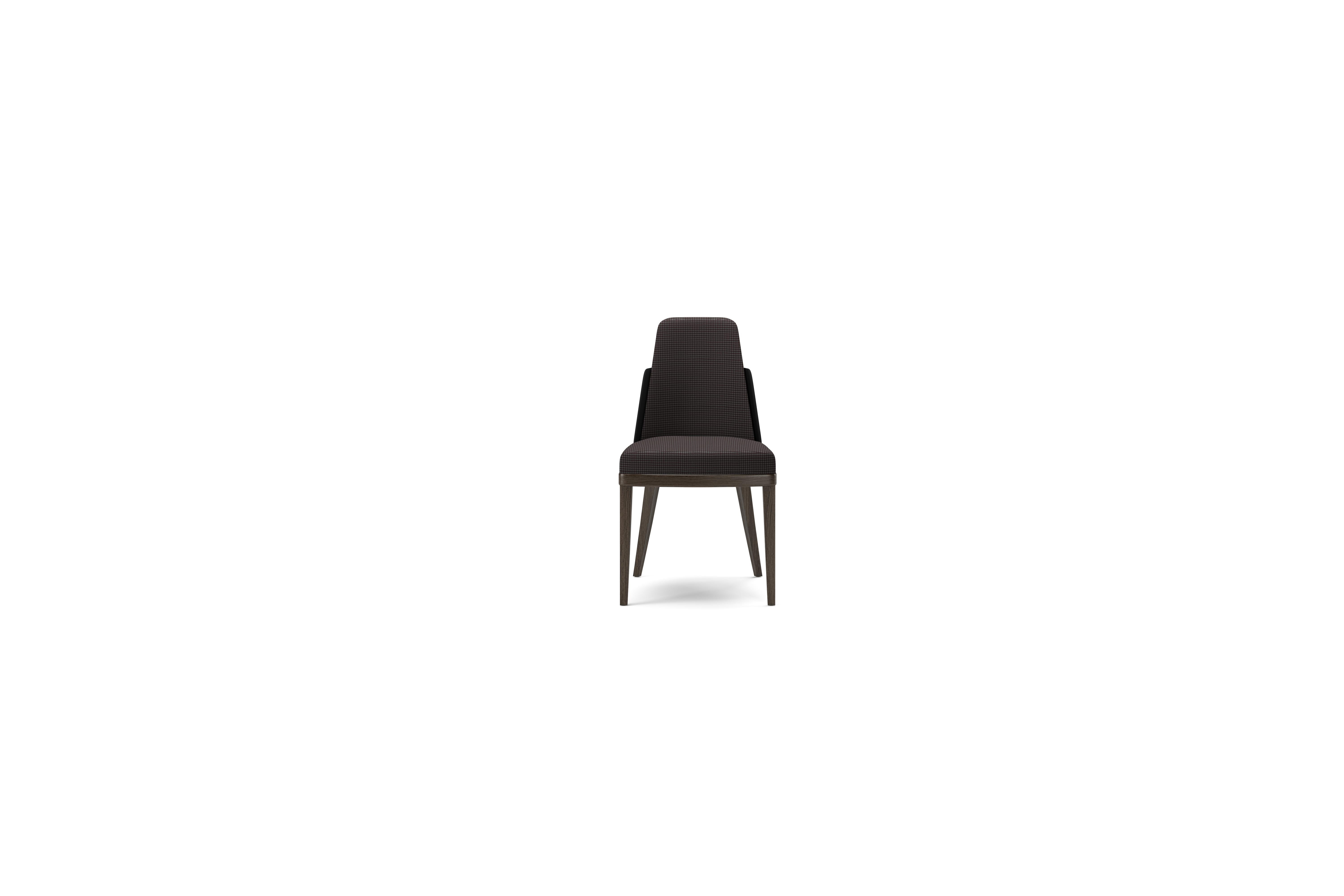 Nora dining chair, a wood padded structure with multi density foams covered in velvet or leather. The legs are in a smoked gray oak.

Nora is part of the 