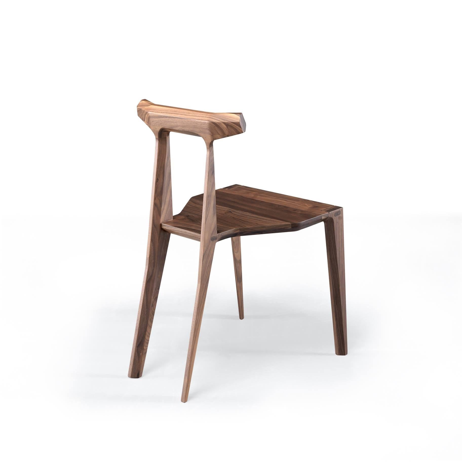  This dining chair is crafted entirely from walnut wood, embodies a delicate balance of lightness and sophistication through its design, while also ensuring durability and comfort through meticulous craftsmanship and choice materials.
The fusion of