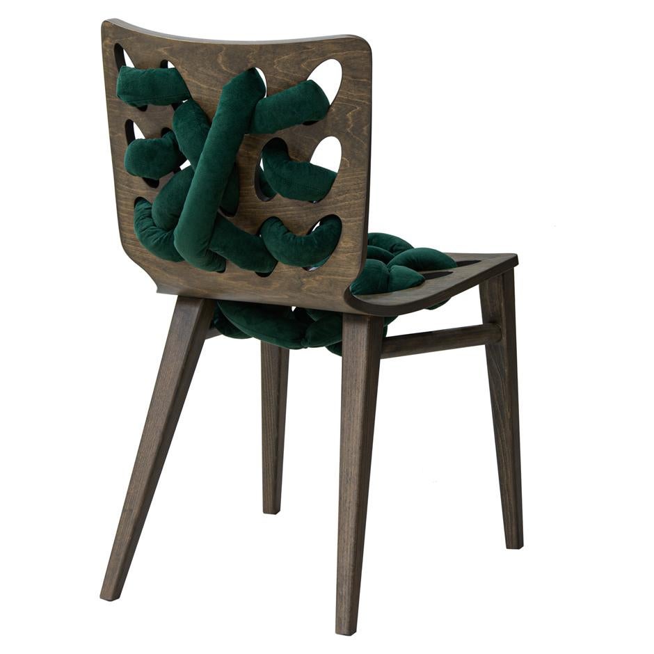 Designer chair offered in unique shape and woven velvet design on the seat and back for extra comfort. made of solid wood stained in walnut finish and the velvet is deep green velvet.
Velvet is water repellent and stain resistant.
Suitable for
