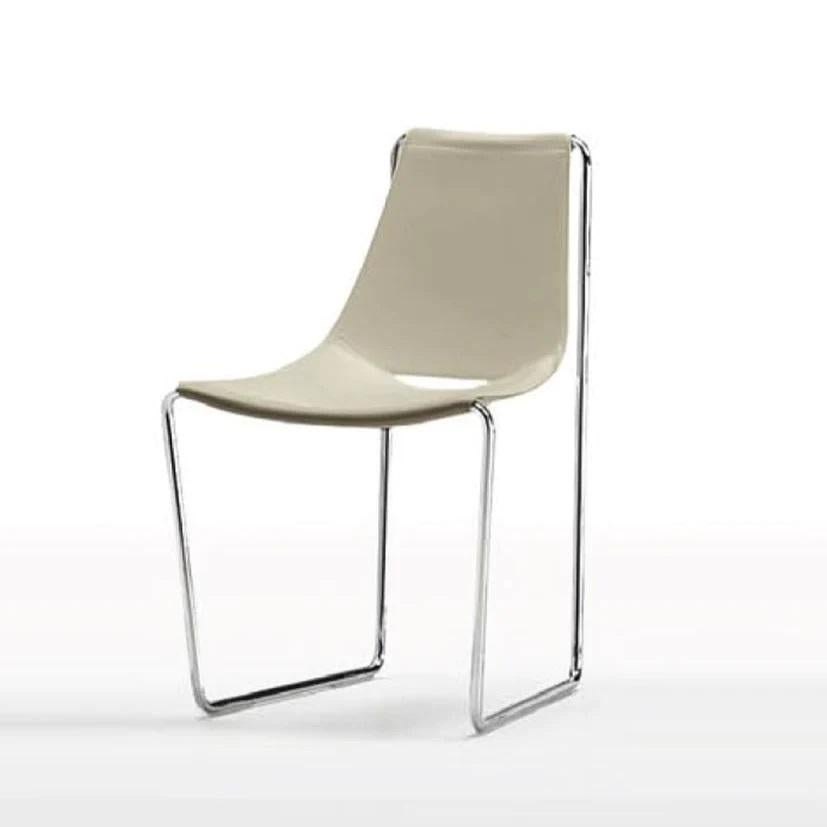This chair is crafted from steel and leather of very high resistance and quality: high-end materials guarantee the necessary flexibility while meeting high production requirements. 
Materials: 
Sled base in lacquered steel
Seat and backrest in