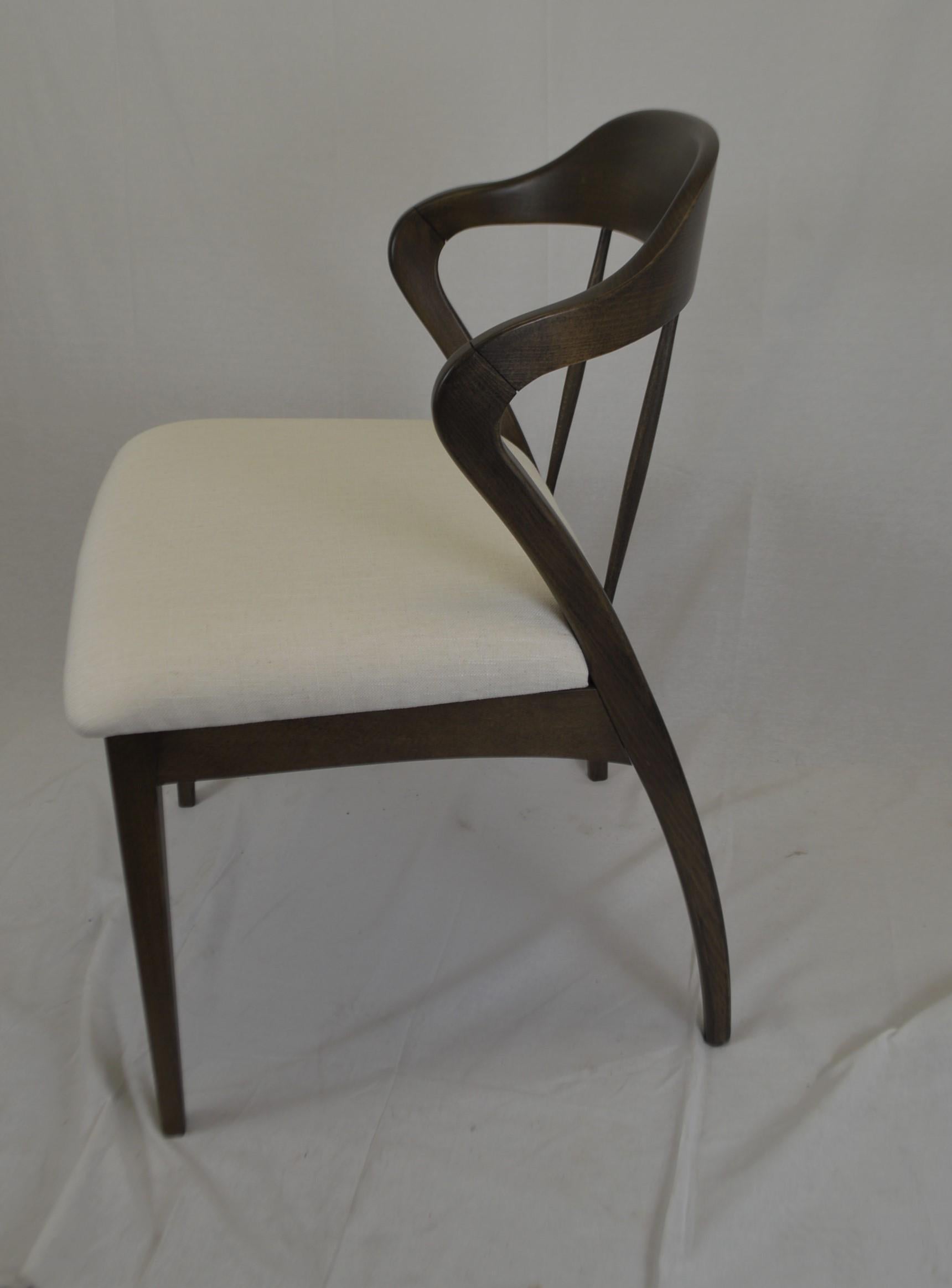 Contemporary design wooden dining chair made in Italy of beech wood.
We offer custom finish of the wood, painted or wood stain and upholstery of the seat with your fabric.