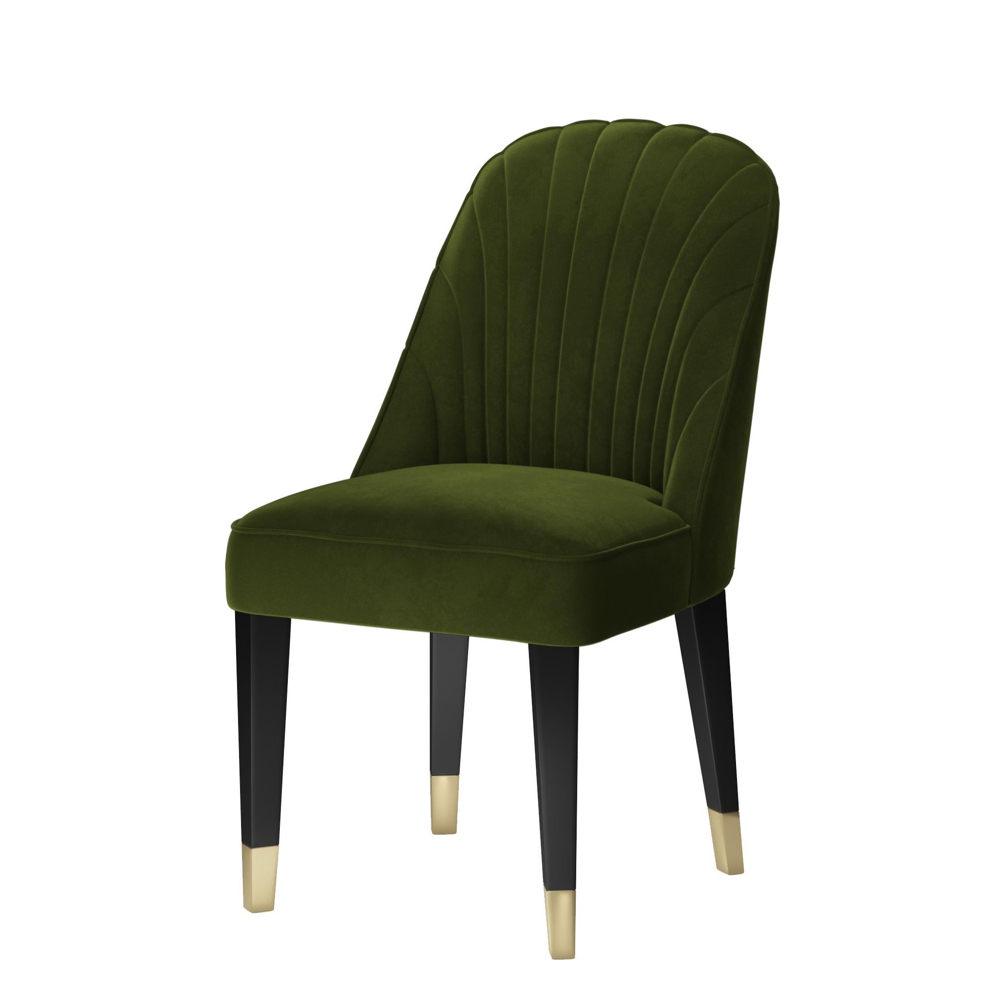 Velvet Upholstered dining chair featuring a sculptural curved back with tufted padding to achieve the perfect angle for relaxation. Upholstered in stain resistant and water repellent velvet.
Frame finished in ebony with polished stainless steel