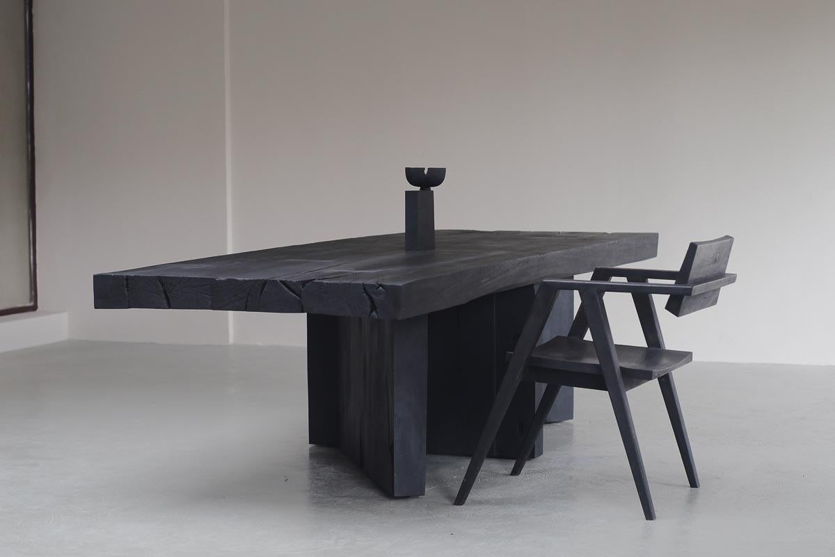 Customizable dining table Acros by Camilo Andres Rodriguez Marquez (aka CarmWorks)

Solid oak or cedar / Burnt wood or natural 
Standard size: H 72 x 300 x 100 cm (customizable) 

Each piece is made to order and hand crafted by the artist. 

(Packed