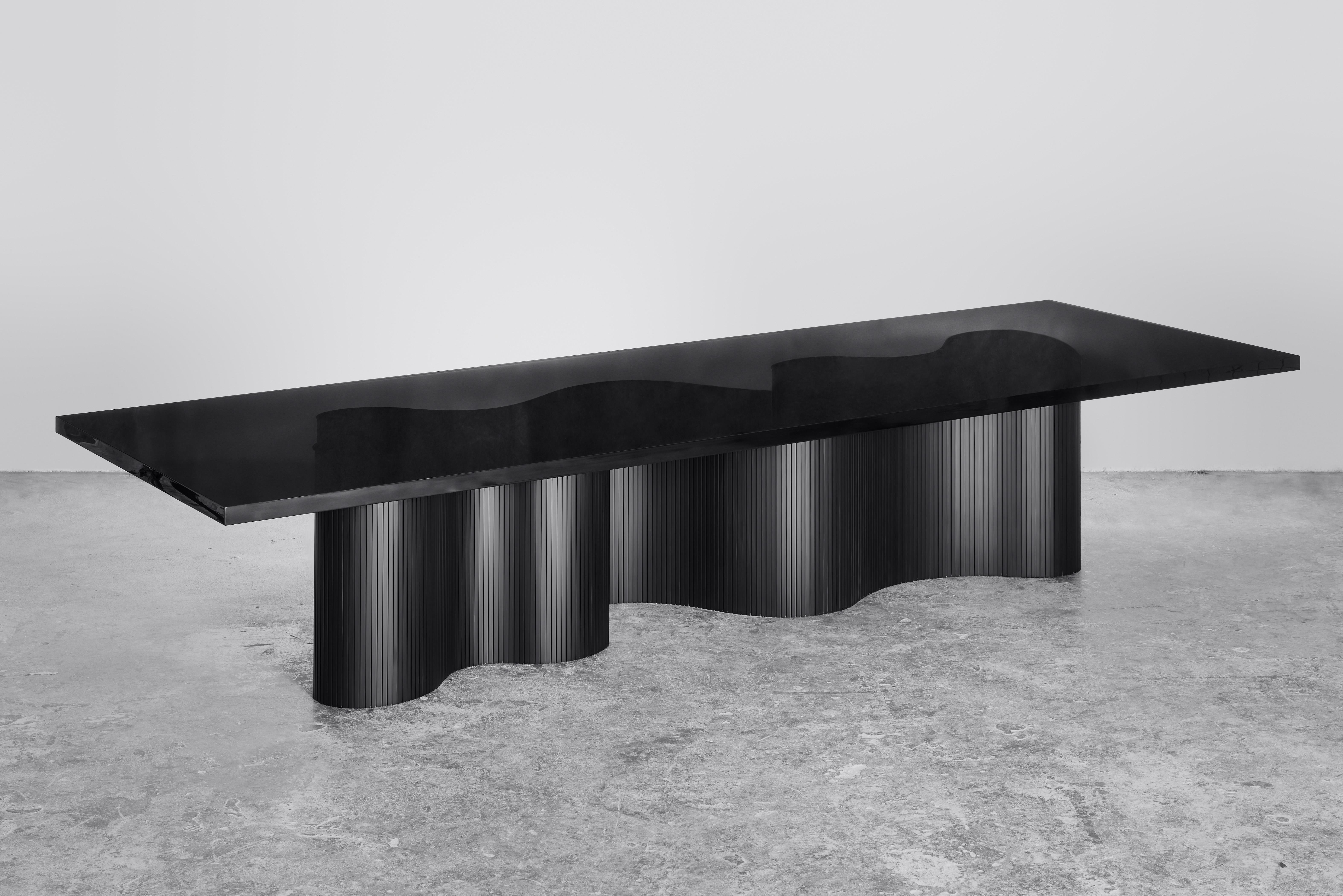Spine is a series of tables consisting of two components, a thin aluminum sheet captured in
a cast resin surface. The series is a result of many material explorations concerned with bent forms and enhanced flexibility. 

The spine of each table