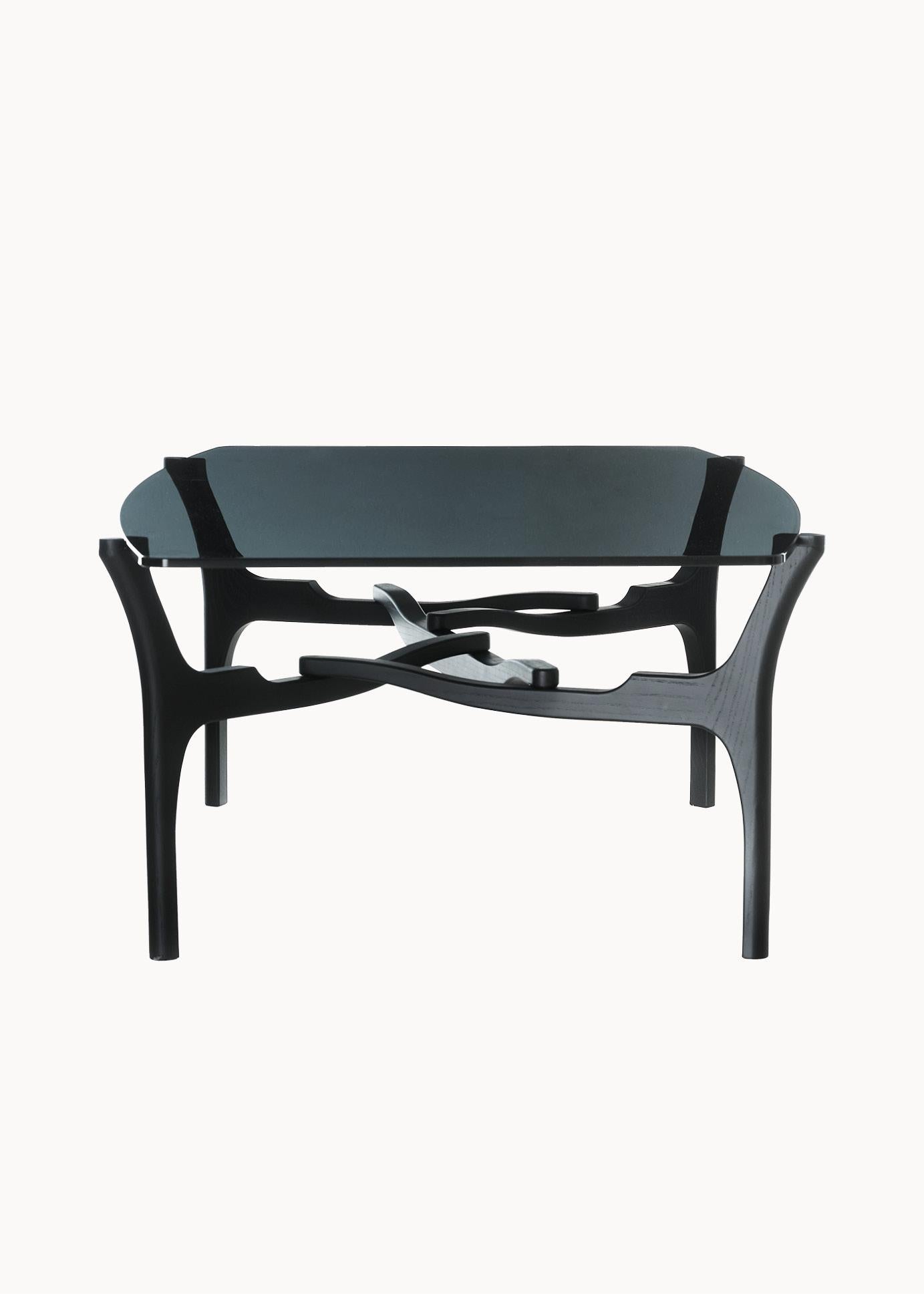 Cheekily calling to Carlo Mollino’s greater influence on Oscar Tusquets, 
these tables were named Carlinas. Their clear surface exposes the
now-visual supporting structures. Like Mollino’s nature-informed pieces, 
the Carlinas boast punctuating