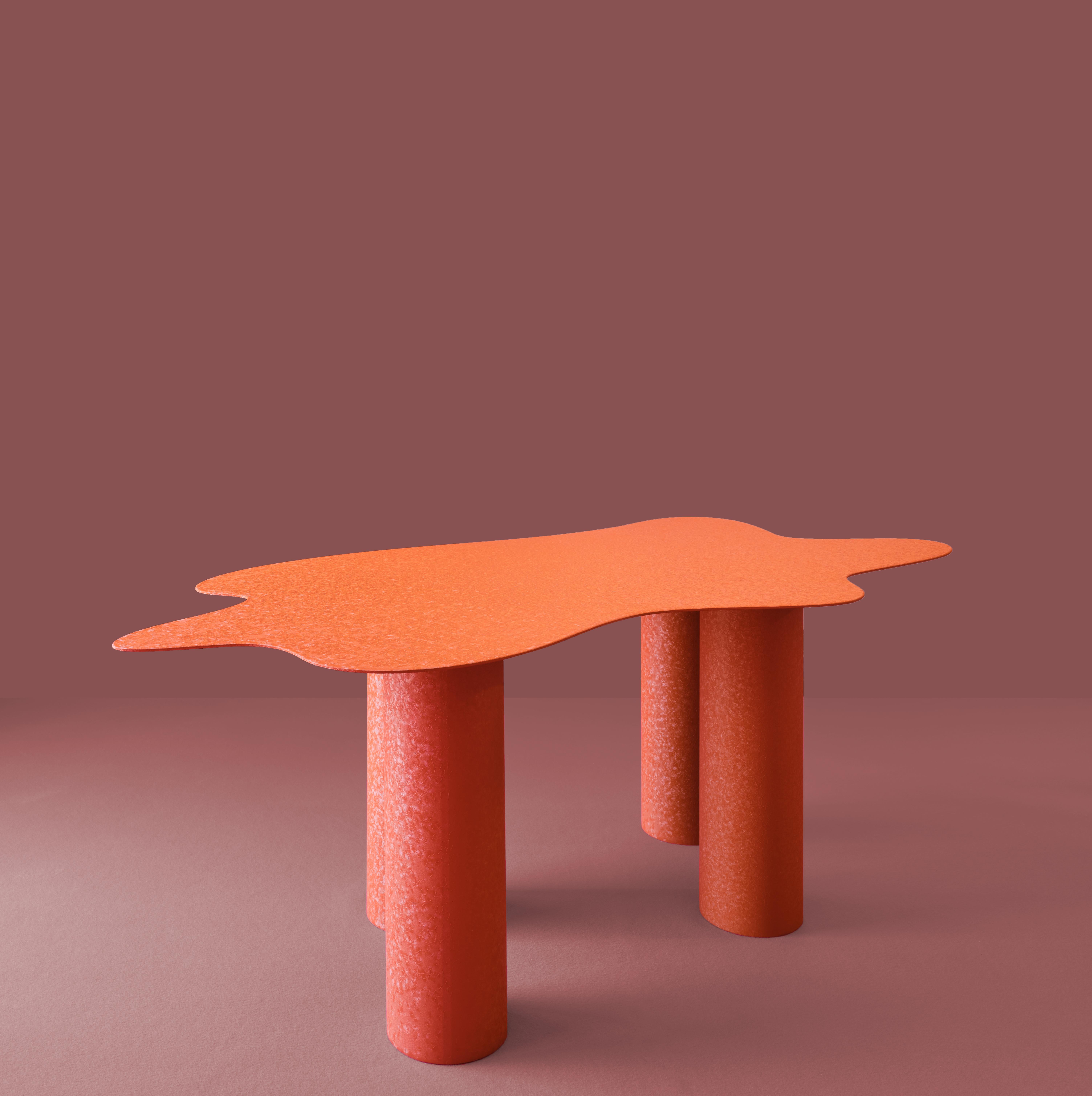 Onda table works on the juxtaposition of volumes and finishing.

A Wavy organic extra-thin top on architectural chunky cylindric legs. Like a paper sheet the top sit gently on the oversize legs to express powdercoated industrial finishes,