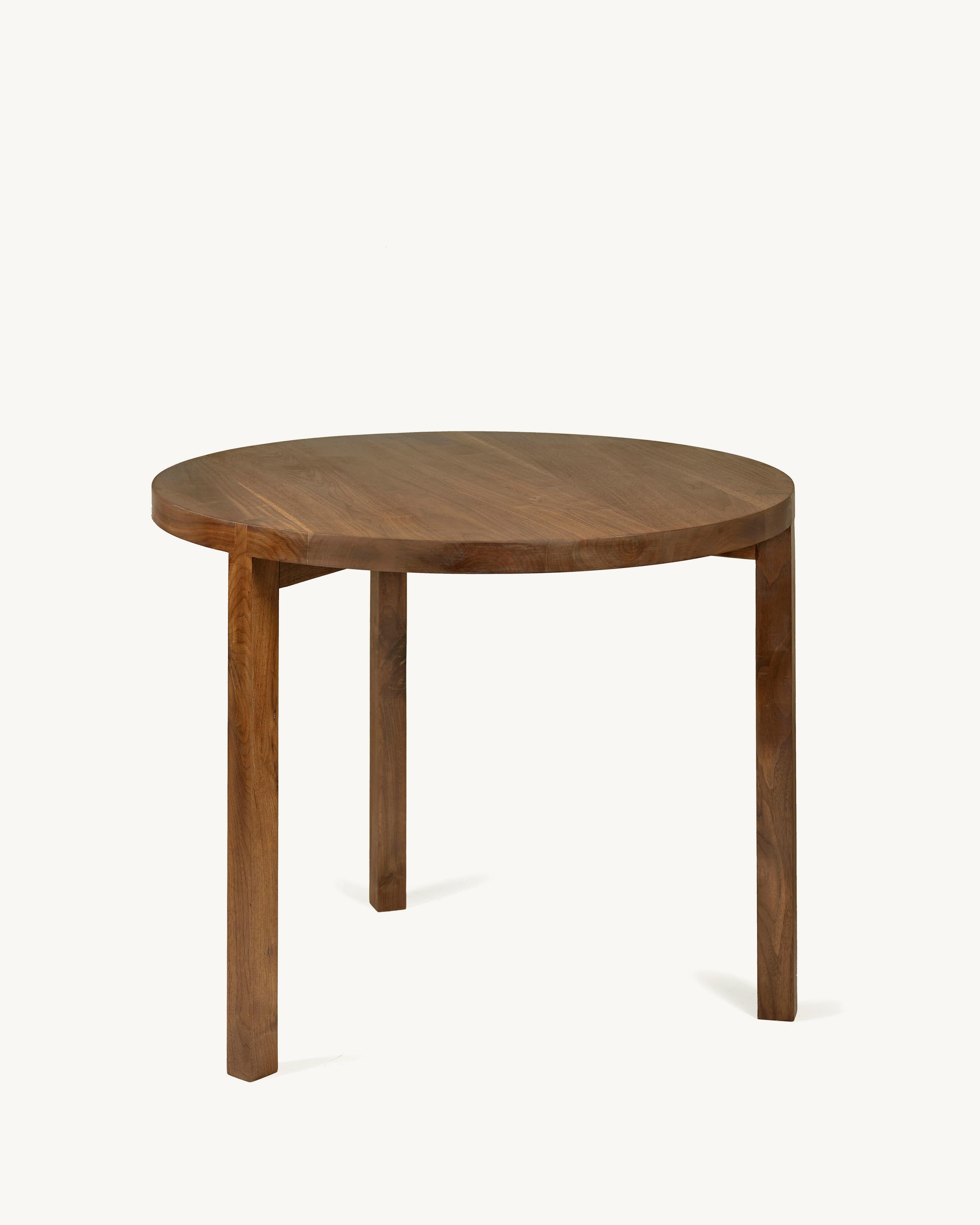 Round Dining Table in Walnut 'Solid' by Atelier 365 x Valerie Objects
Dimensions: D. 90 x H. 75

Fascinated by traditional wood joints, Greindl constructs wooden furniture without any nails or screws. Every joint is cut by hand, using chisels and a