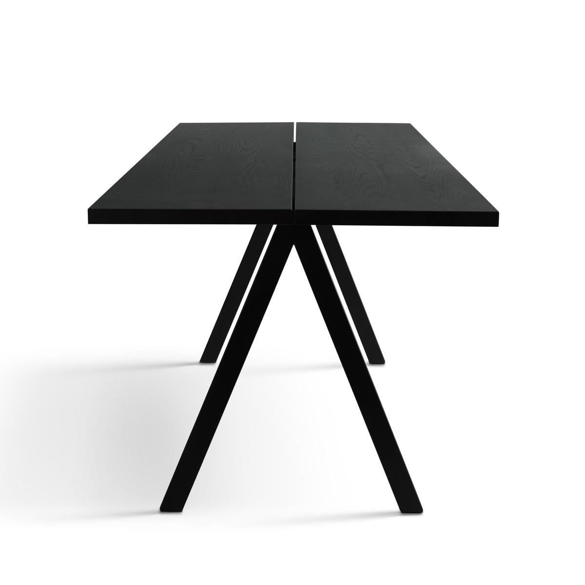 SAW dining table by Friends&Founders
Rectangular
Wood: solid ash, stained satin finish. Frame in powder coated metal.

Several sizes available: 
200 x 80 cm
250 x 95 cm 
300 x 100 cm
340 x 110 cm

Customizable. 

--
Contemporary design