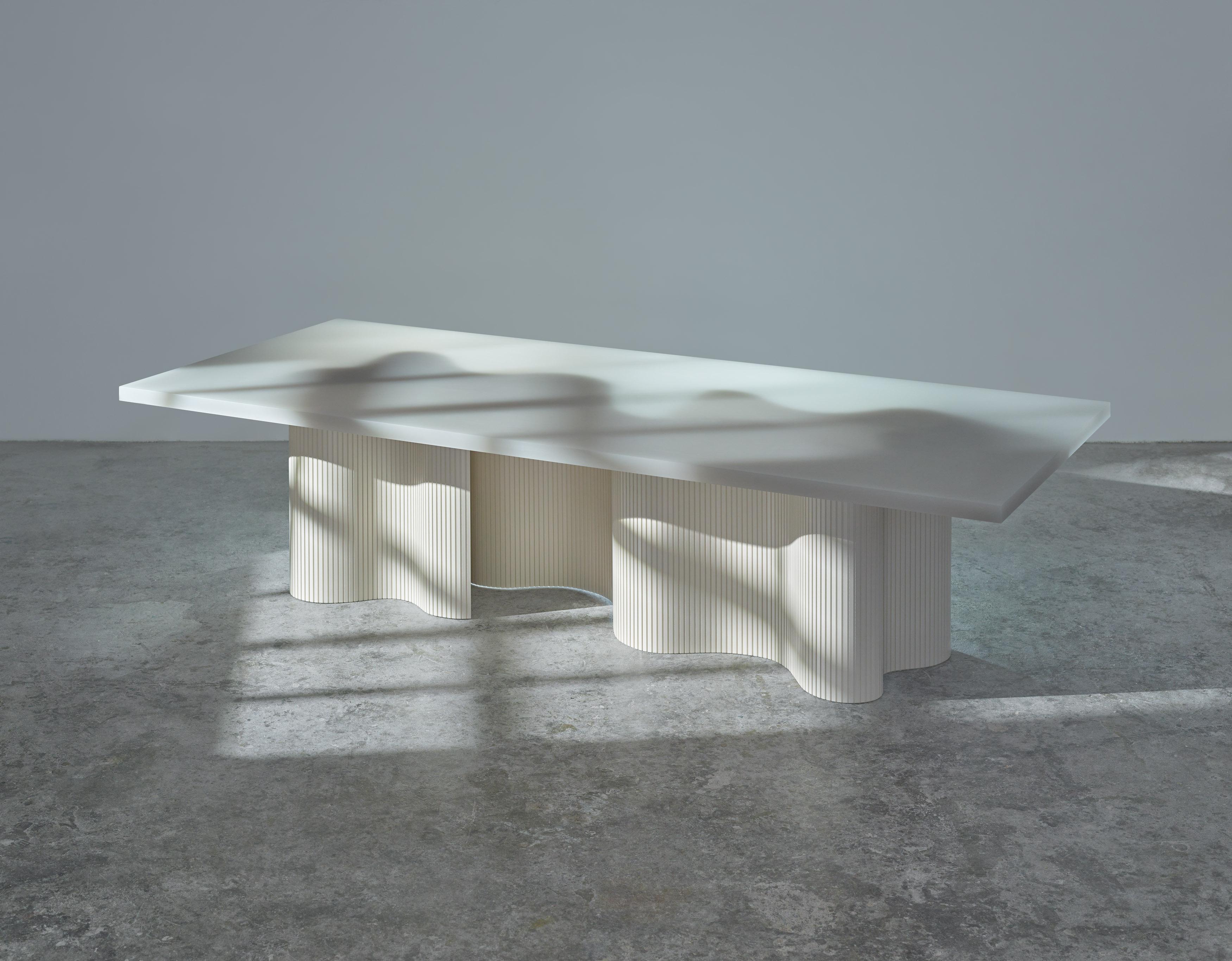 Spine is a series of tables consisting of two components, a thin aluminum sheet captured in
a cast resin surface. The series is a result of many material explorations concerned with bent forms and enhanced flexibility. 

The spine of each table