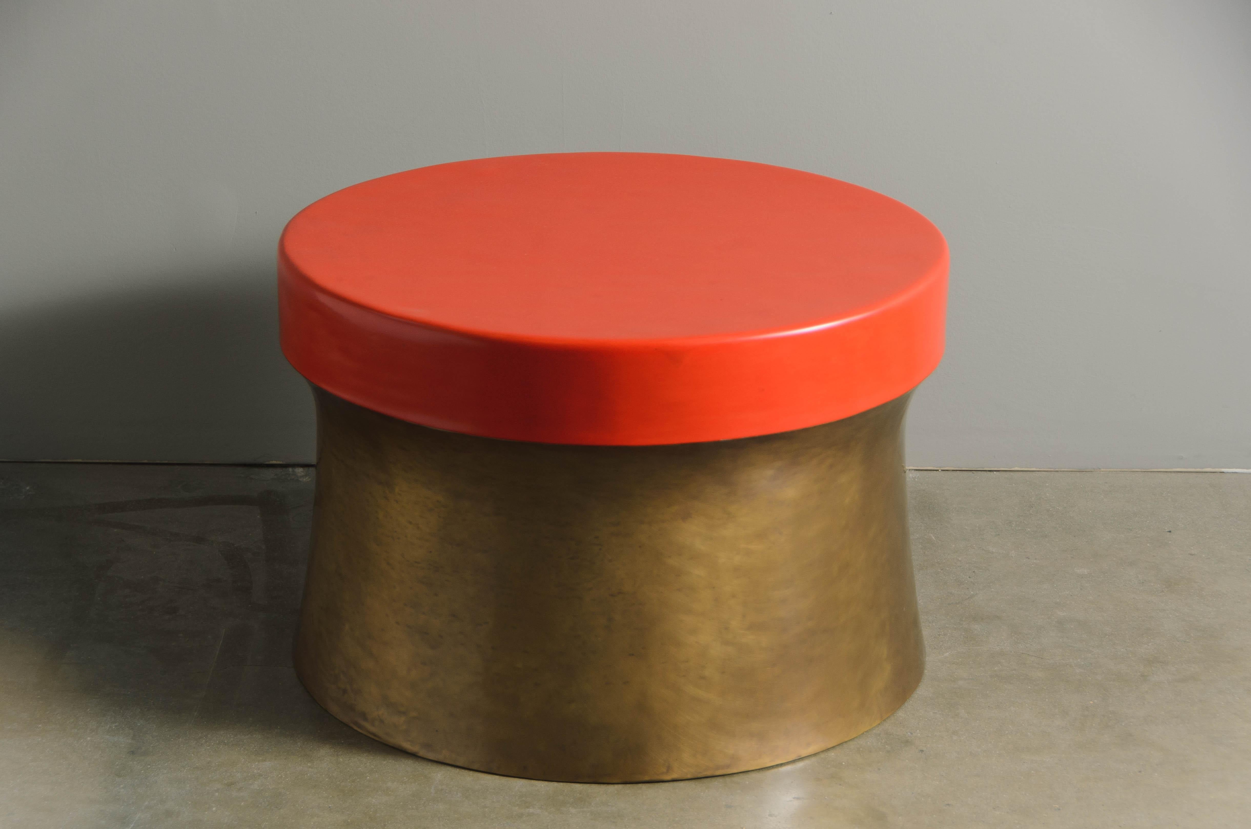 Dong Shan Table w/ Brass
Red Lacquer Top
Hand Repoussé Brass
Contemporary 
Limited Edition

Repoussé is the traditional art of hand-hammering decorative relief onto sheet metal. This technique involves using a hammer and various shaping tools.