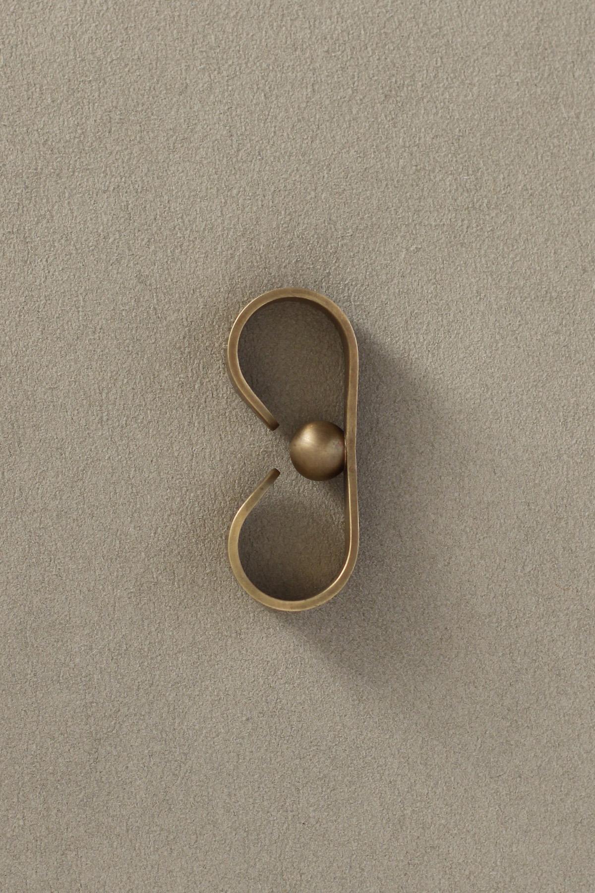 Door Handle or Knob 'Prim' by Spaces Within, Amber Brass

Dimensions
Height: 61 mm
Width: 13 mm
Depth: 25 mm
Weight: 34 g

A delightful piece with lots of character, PRIM expresses a clear signature of joy. The matte finish has a natural looking