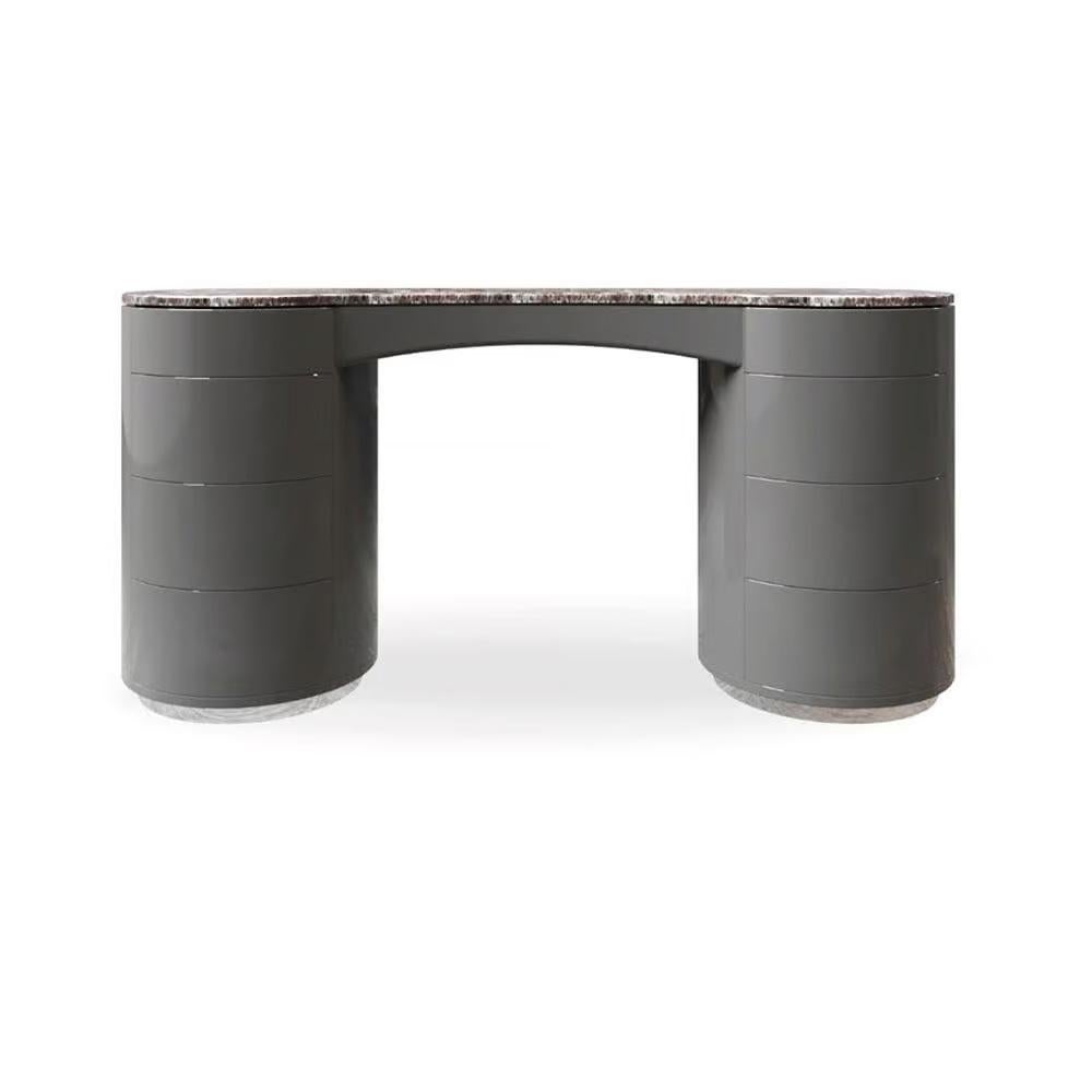This dressing console is a sculptural masterpiece, defined by its bold yet refined silhouette. The design features a curved, contoured top crafted from luxurious marble, supported by two cylindrical bases. The rounded forms and seamless finish give