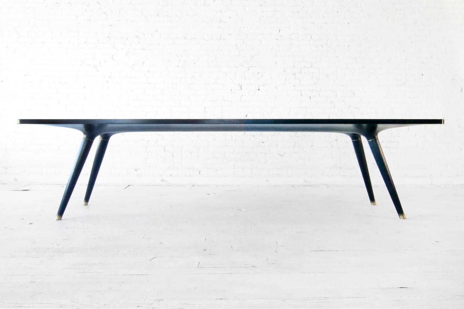 Ebonized dining table 001 from Series001 by Vincent Pocsik.

Vincent Pocsik finds the balance between old and new fabrication techniques working in conjunction to find an anatomical form that creates its own presence. Series 001 is about finding