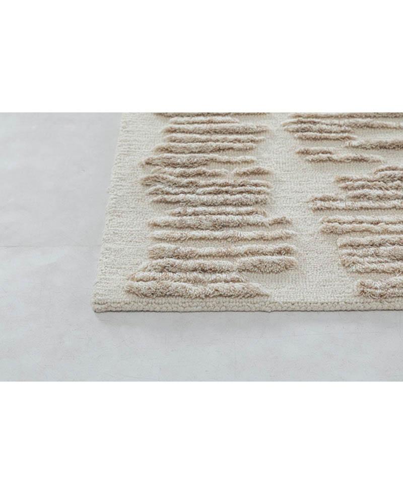 Unique tufted wool rug that seamlessly blends modern aesthetics with exquisite craftsmanship. This one-of-a-kind piece boasts a contemporary design, elevating any space with its artistic flair. Crafted from high-quality wool, the rug not only exudes