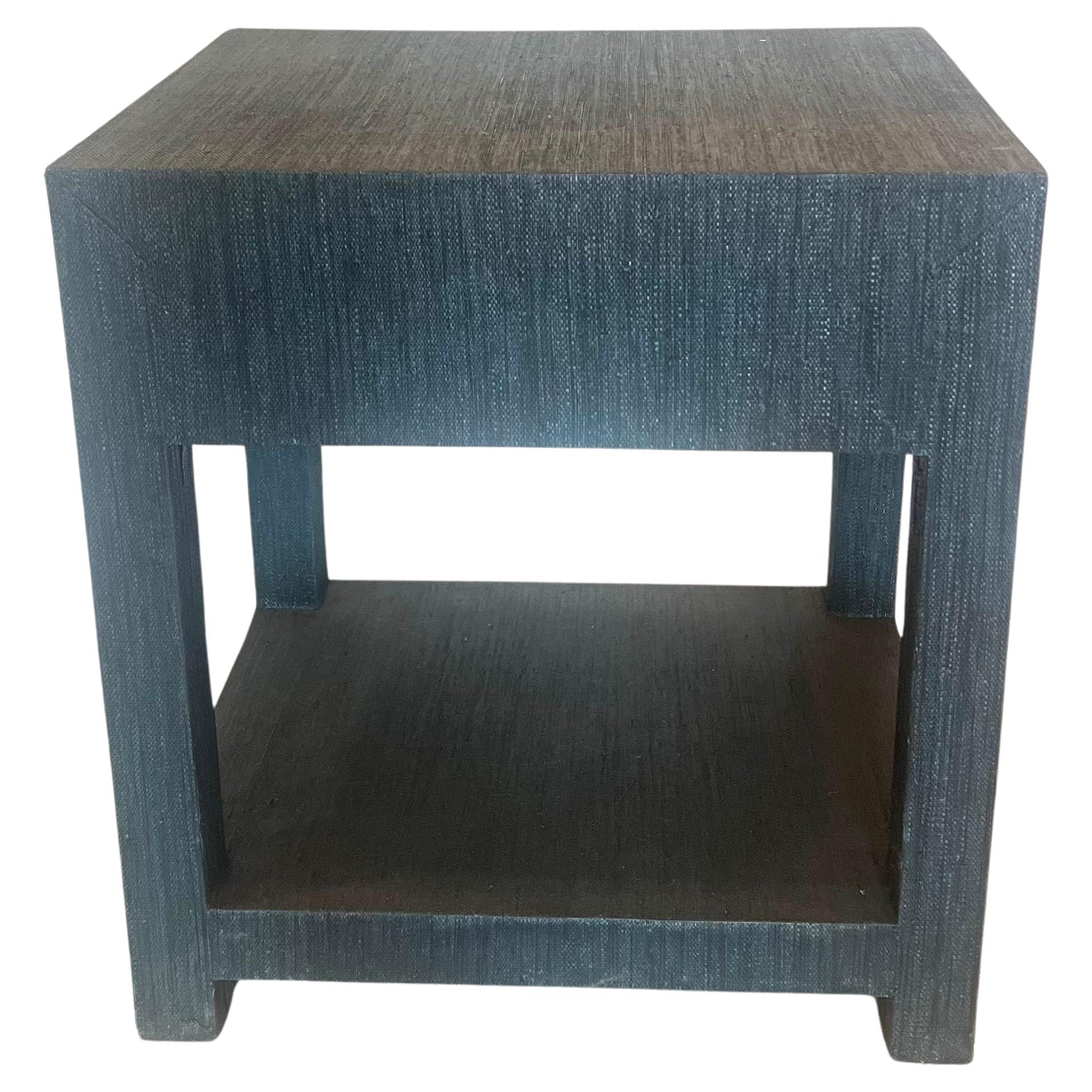 Hand wrapped in painted navy blue linen. A matte lacquer finish. A single drawer, a glint of brass. beautiful elegant nightstand excellent quality nice condition,  linen. A matte lacquer finish. A single drawer, a glint of brass.

Frame is solid