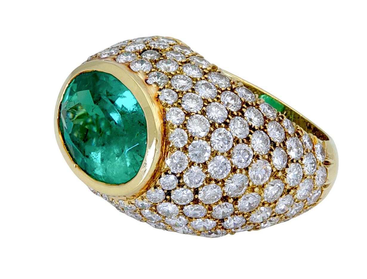 Oval Cut Contemporary Emerald and Diamond 18 Karat Yellow Gold Ring For Sale