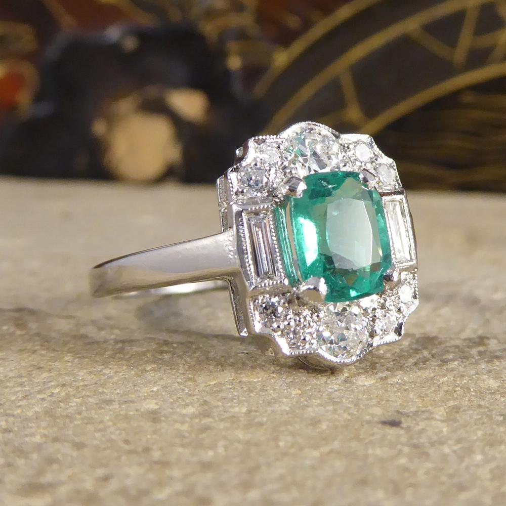 Such a beautiful contemporary ring featuring a 0.90ct Emerald gemstone with a Diamond surround. With baguette and modern brilliant cut Diamonds of different weights, this ring has a total of 0.30ct Diamonds allowing it to sparkle beautifully on the