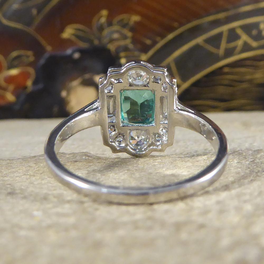 Contemporary Emerald and Diamond Cluster Ring Set in Platinum In Good Condition In Yorkshire, West Yorkshire