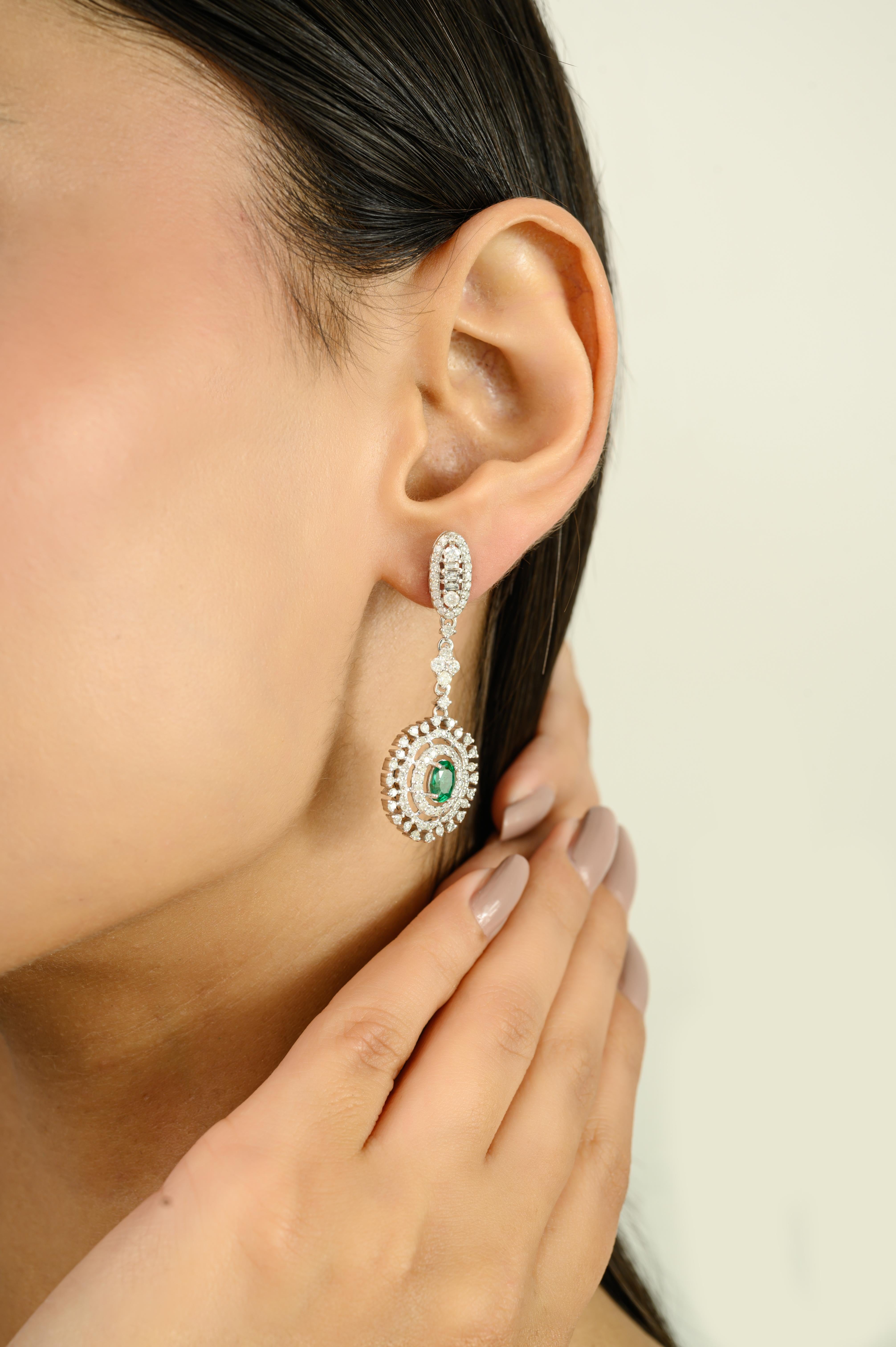 Contemporary Emerald and Diamond Floral Drop Earrings Crafted in 14K White Gold For Sale 1