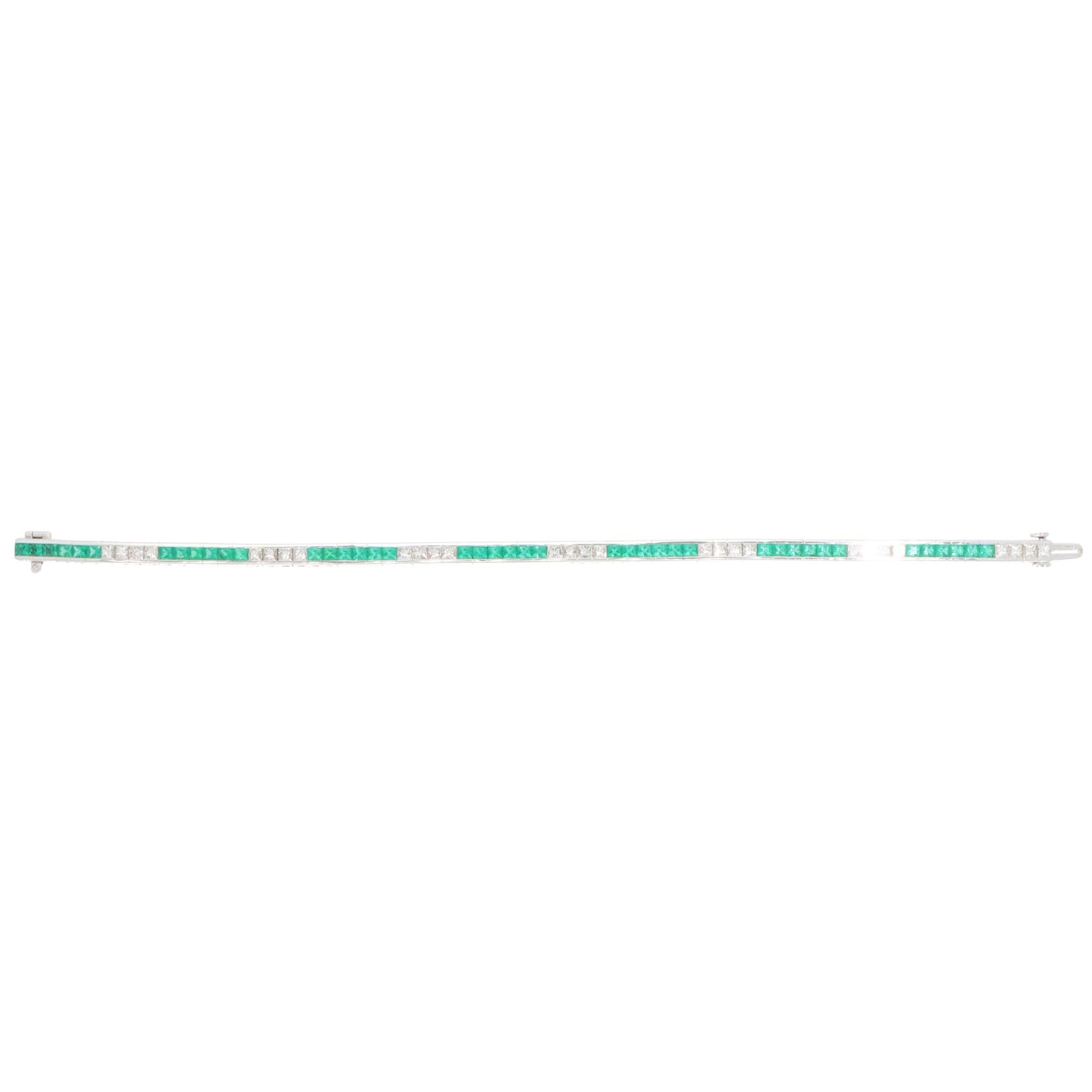 A beautiful contemporary emerald and diamond line tennis bracelet set in 18k white gold.

The bracelet is composed of a grand total of 42 square scissor-cut vibrant emeralds and 24 French-cut diamonds. All stones are securely channel set and