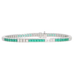 Bracciale tennis contemporaneo con linea di smeraldi e diamanti