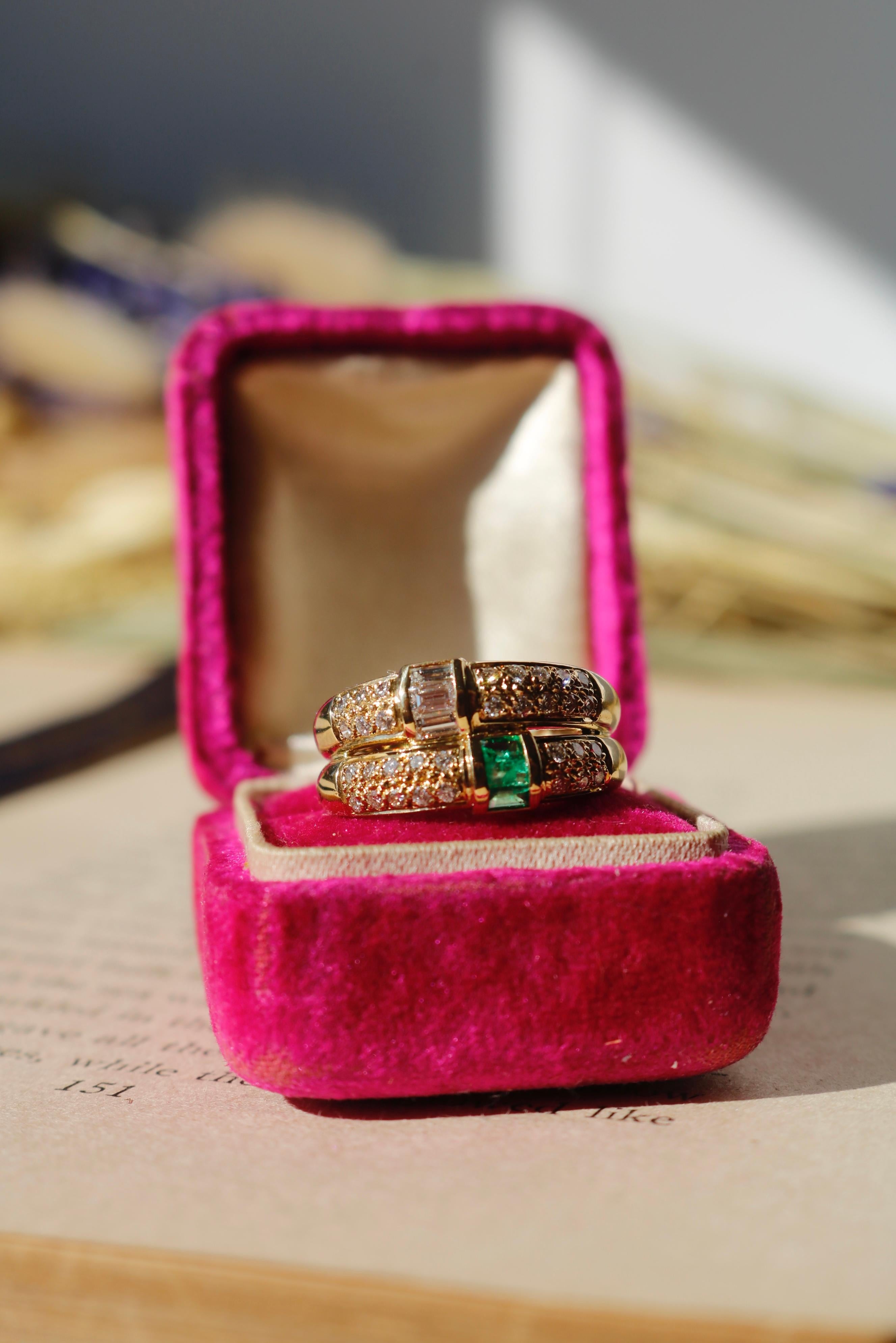This contemporary 18-karat yellow gold ring offers a striking balance of color and brilliance. Three baguette-cut emeralds, totaling approximately 0.15 carats, are elegantly set beneath three baguette-cut diamonds, approximately 0.18 carats, with G