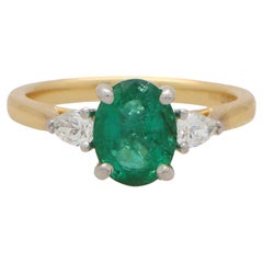Contemporary Emerald and Pear Cut Diamond Three Stone Ring in 18k Gold