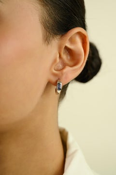 Contemporary Emerald Cut Blue Sapphire Huggie Hoop Earrings in 14K White Gold