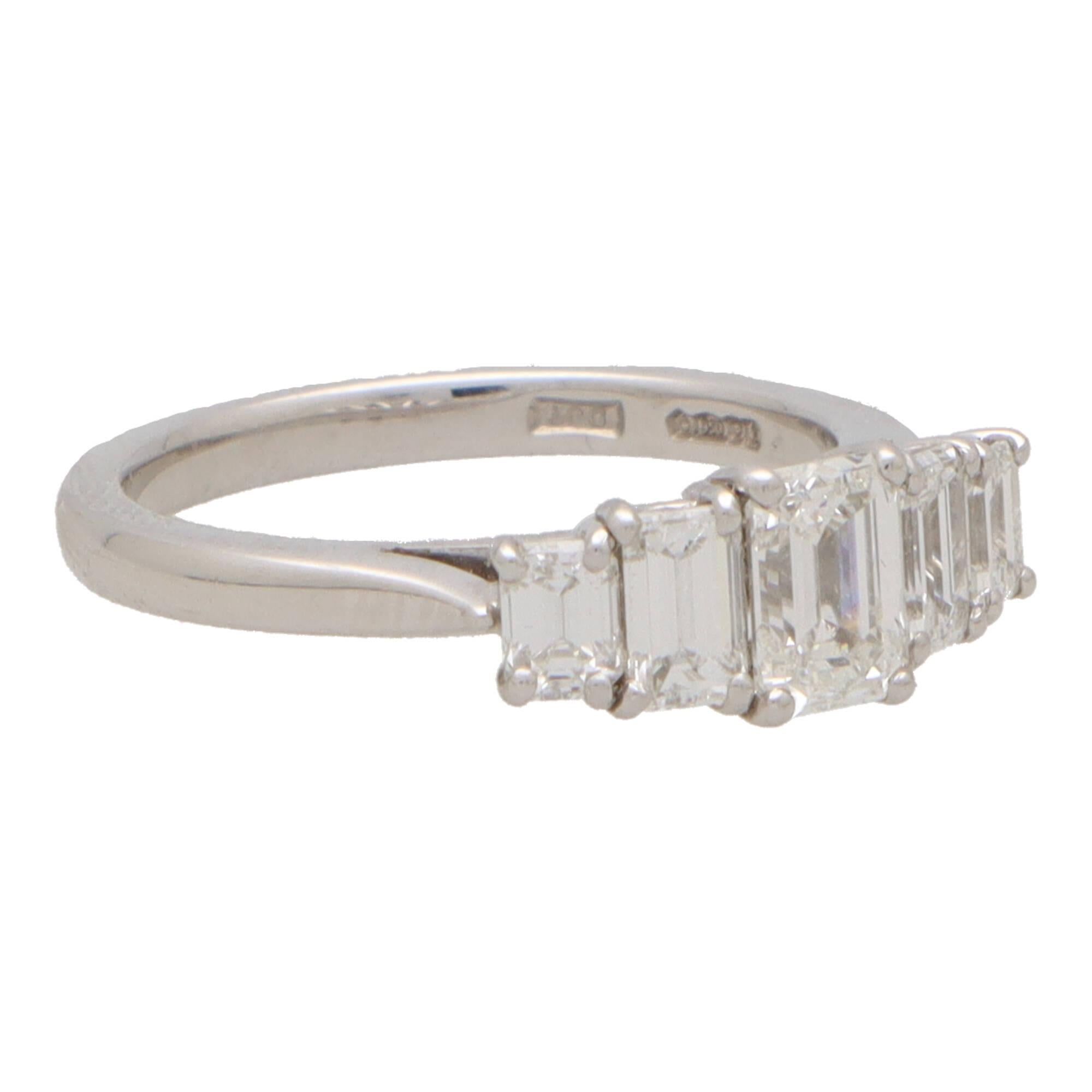 A beautiful contemporary certified diamond five stone ring set in platinum.

The ring is composed of five graduating emerald cut diamonds; all of which are securely four-claw set in an open back setting within a 2-millimetre band.

Due to the size