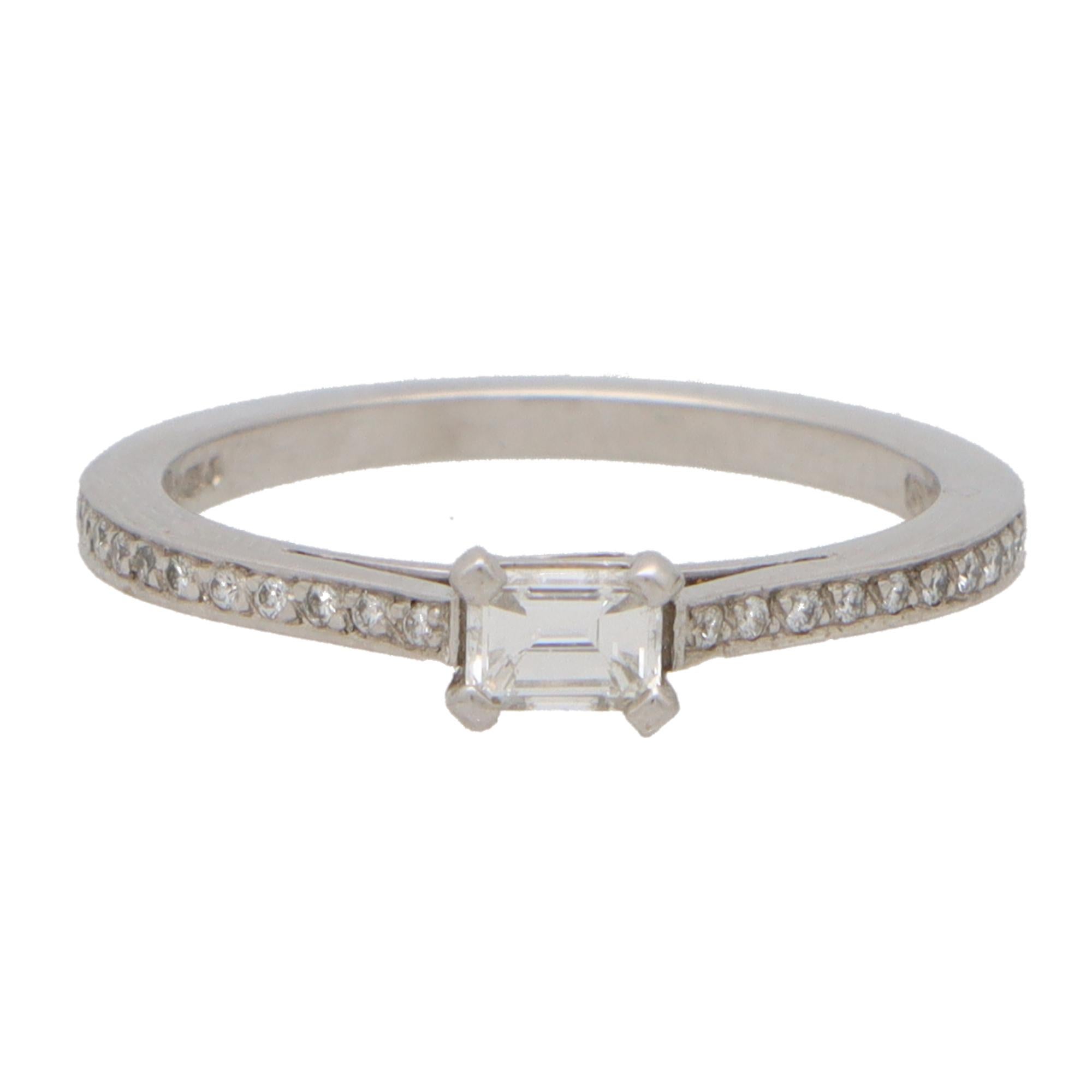 Contemporary Emerald Cut Diamond Ring with Diamond Shoulders in Platinum In New Condition In London, GB