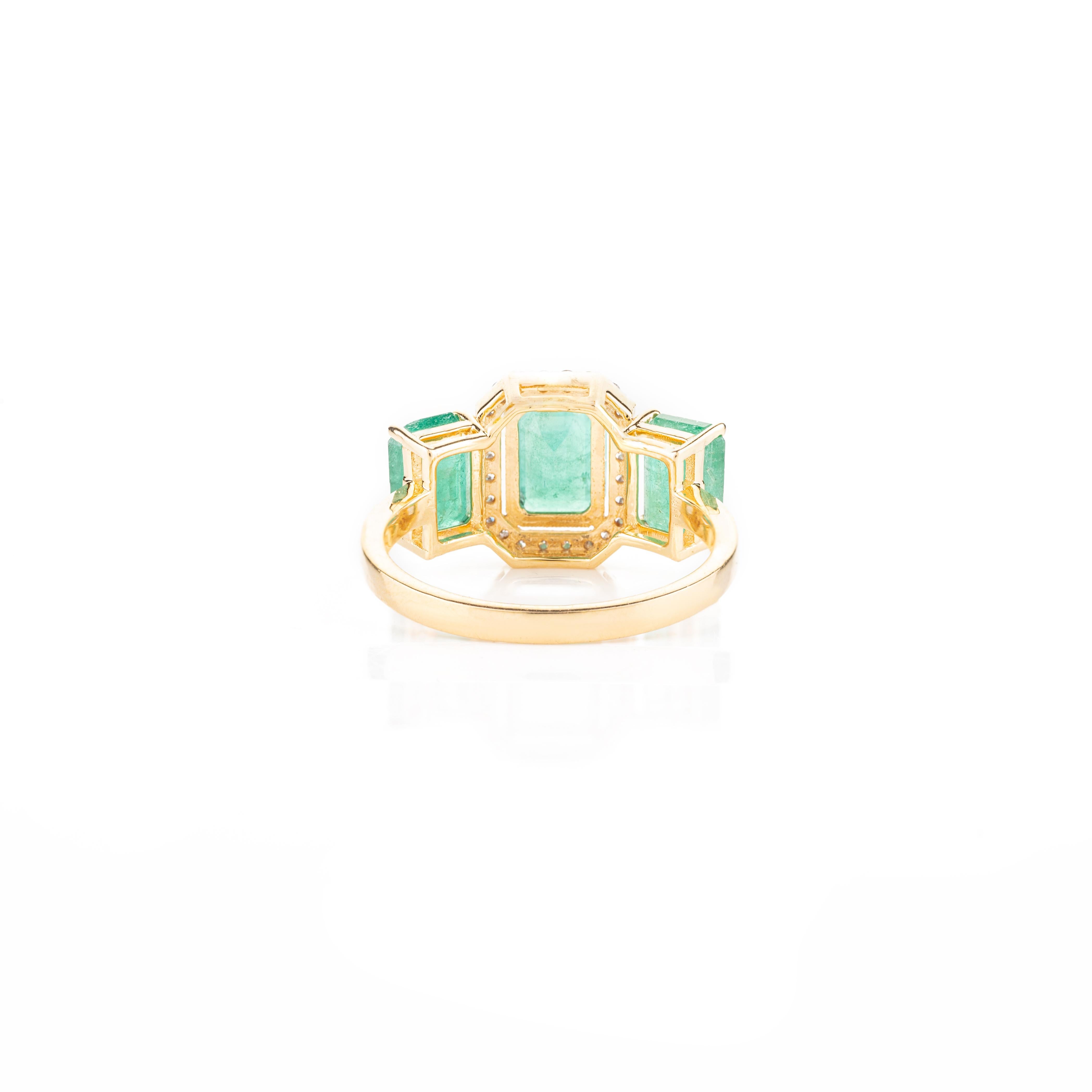 For Sale:  Contemporary Emerald Three Stone 18k Yellow Gold Ring with Halo Diamonds 6