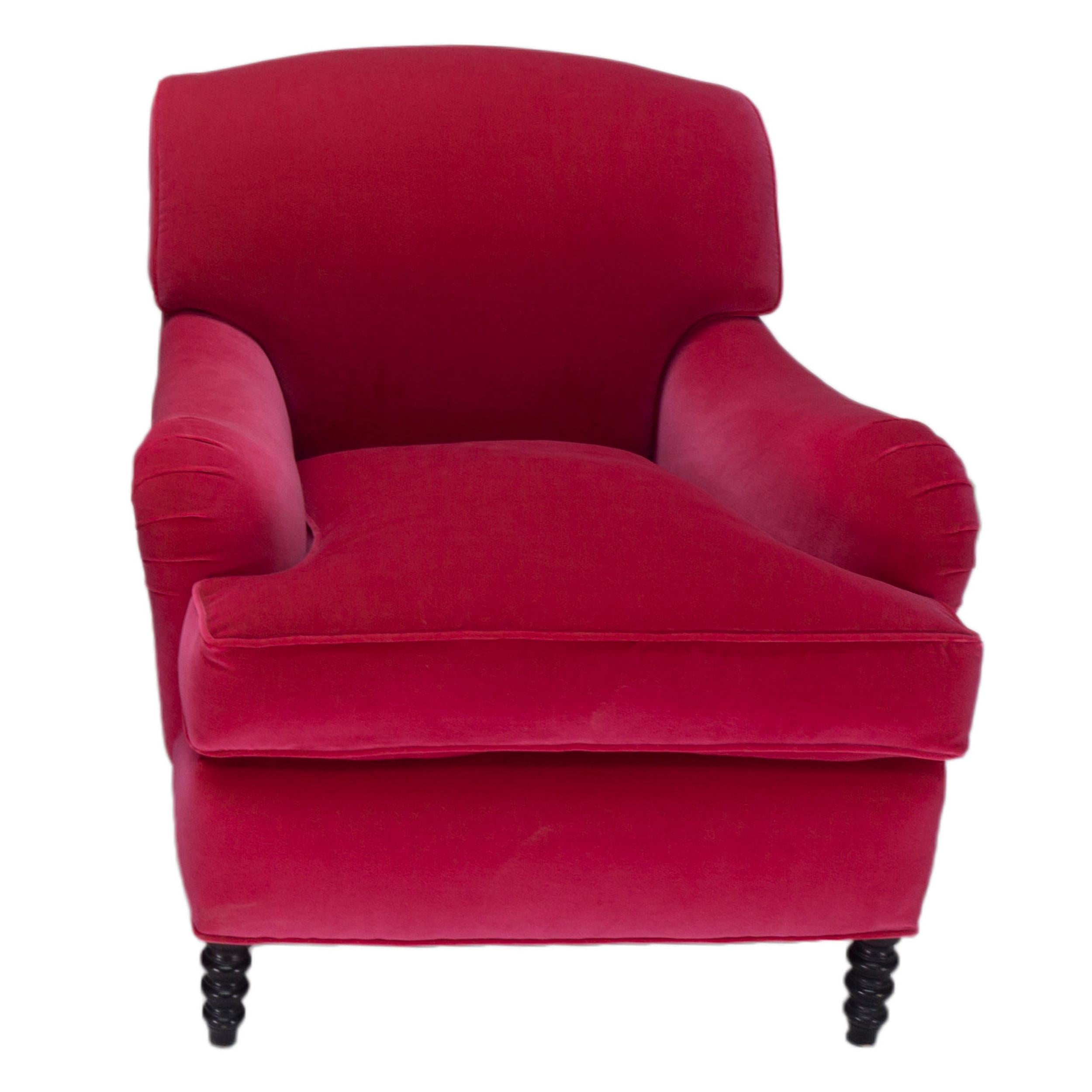 Contemporary take on English Roll Arm-style chair with a tight back and loose seat cushion. The chair also features spool turned legs at the front and a deep seat. Shown in 100% cotton thick pile Fuchsia Velvet. Hand-built to order and customizable