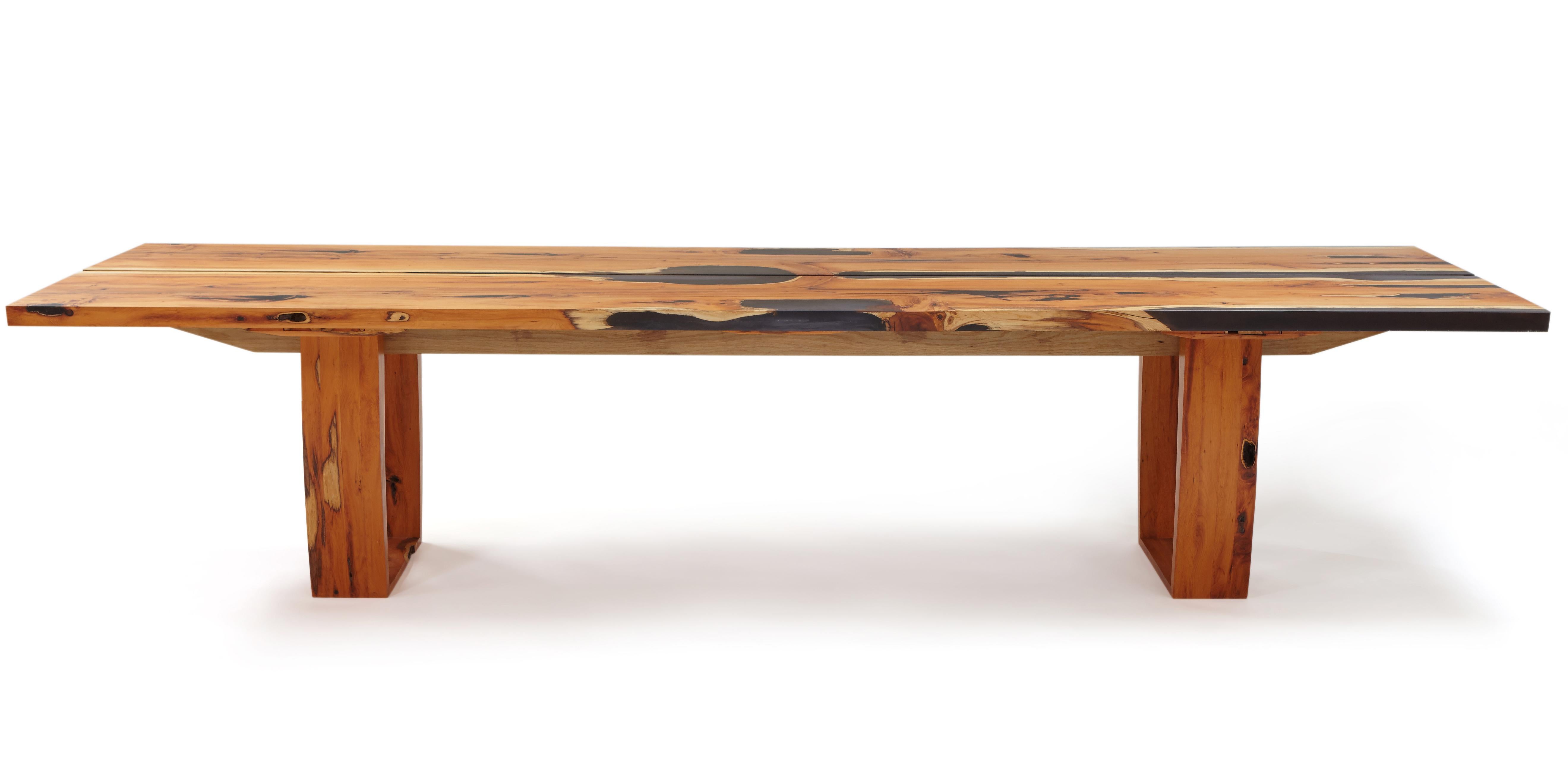 English Yew Table: Unique.  Made from two slabs of mirror image /book matched yew with ebony tinted clear resin along the live edge. The support spines are in solid oak. The table comes apart for moving. 
The tabletop can also be altered to remove