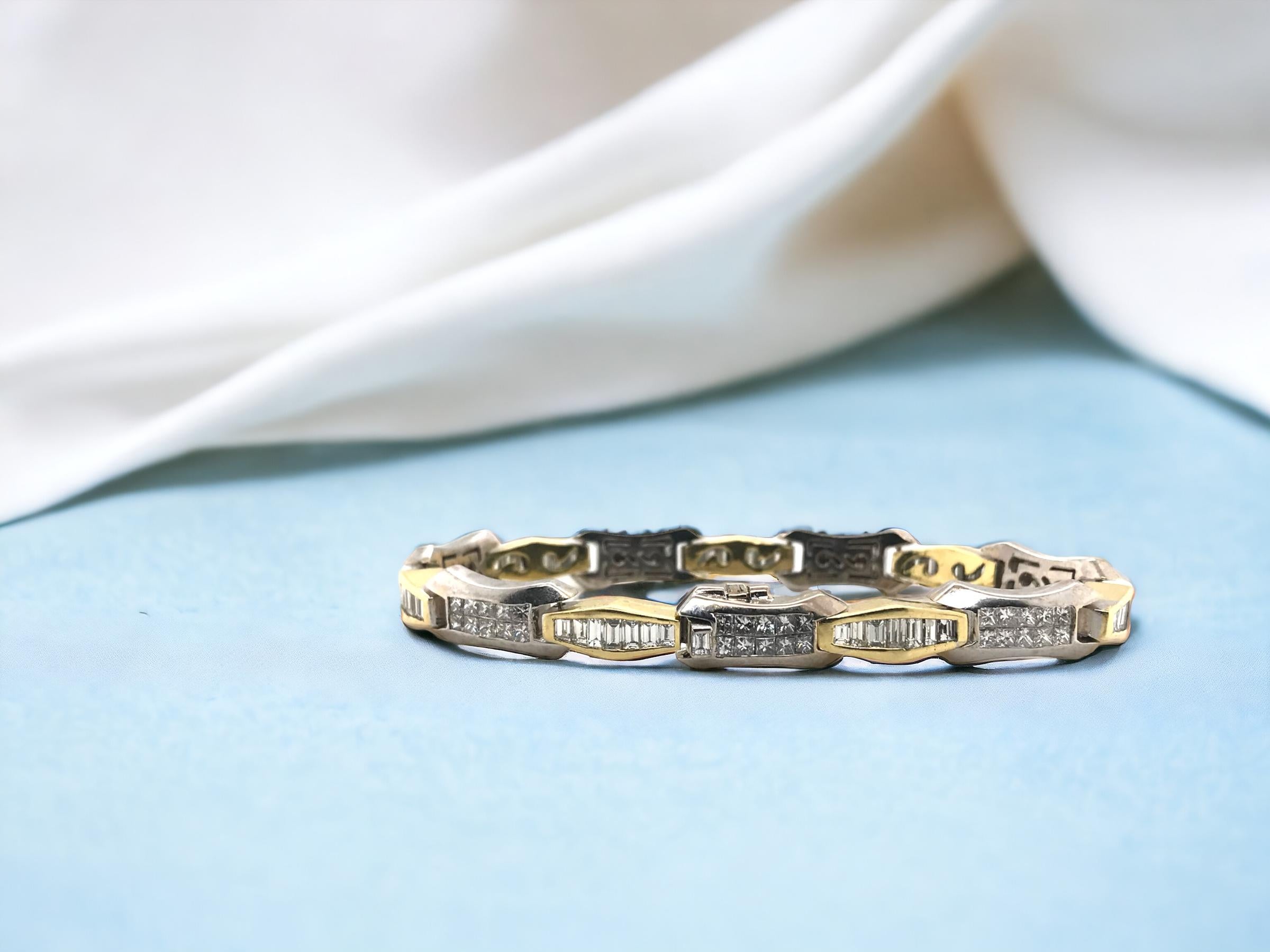 This beauty is absolutely stunning!!
We love the heavy two toned links & combination of unique diamond cuts.

Bracelet Details
Material: 18K Yellow & White Gold
Length: 7 Inches
Width: 7.8mm
Weight: 36.2 Grams

Diamond Details
70 - 2mm Princess Cut